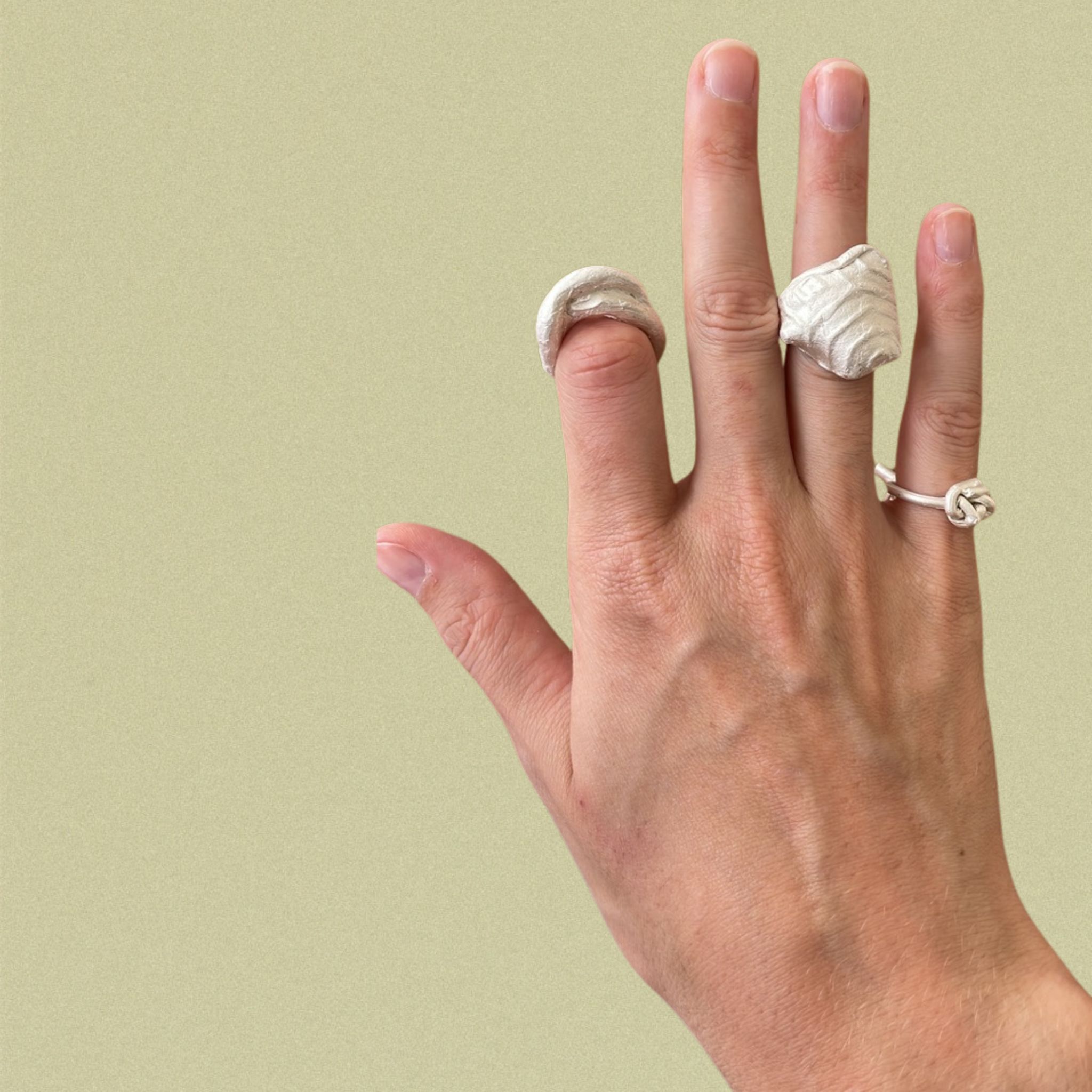 A set of rings made by Esther during the lost-wax workshop. Raw cast, sprue not removed.