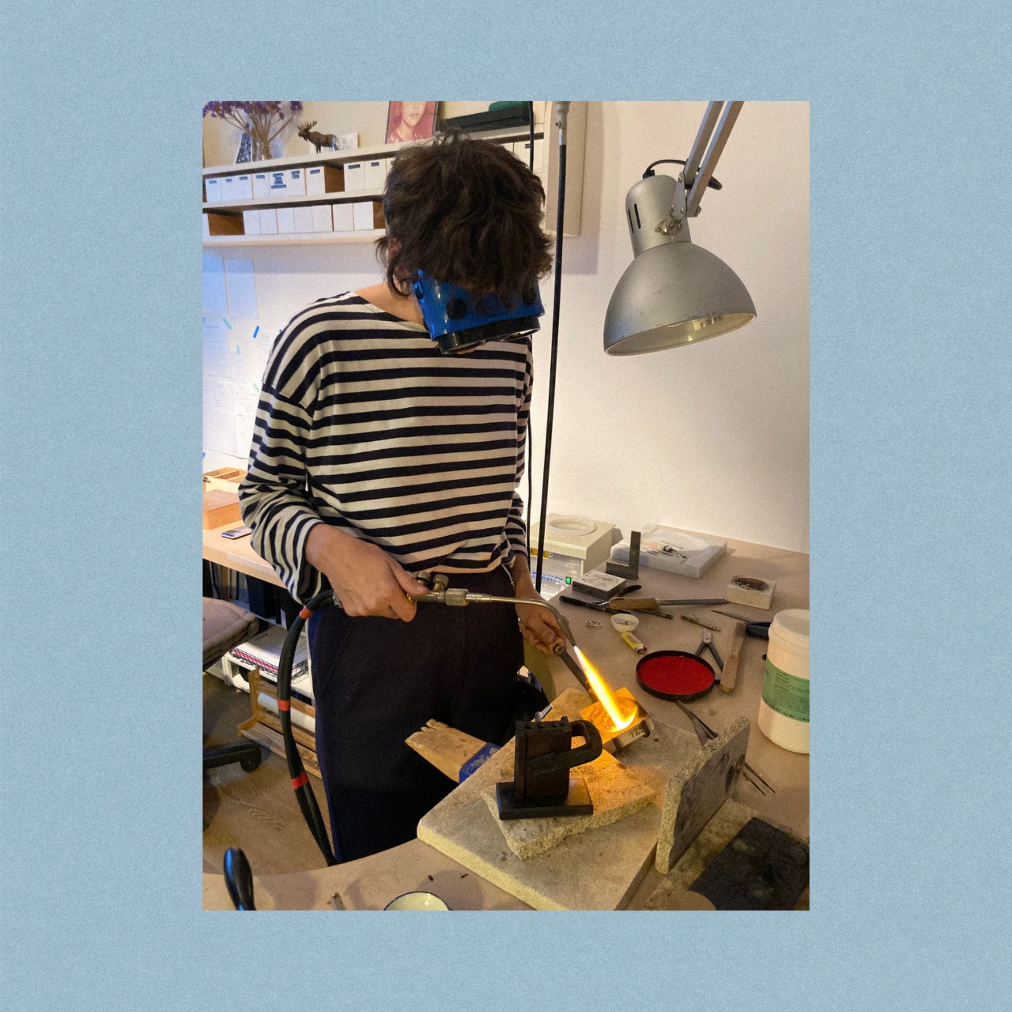 Melting gold in full concentration — funny goggles included.