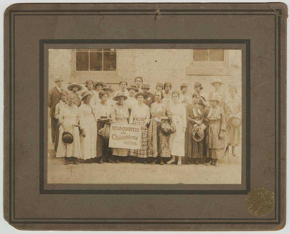 Black women suffragists holding sign reading “Head-Quarters for Colored Women Voters,” in Georgia, 1910-1920, NYPL