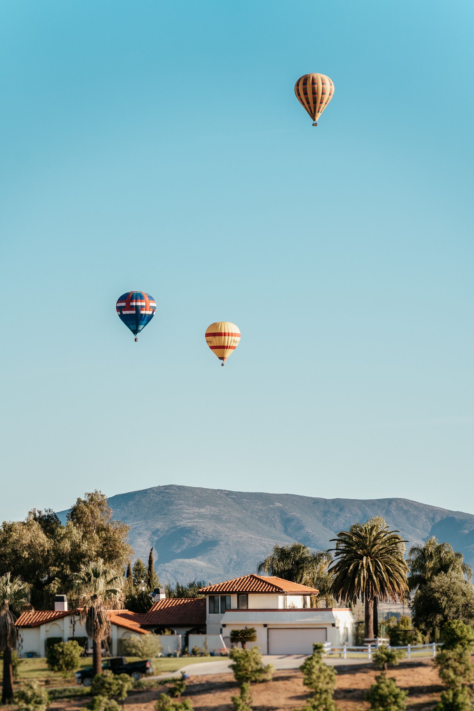 Morning balloons floating over the mountains in Temecula