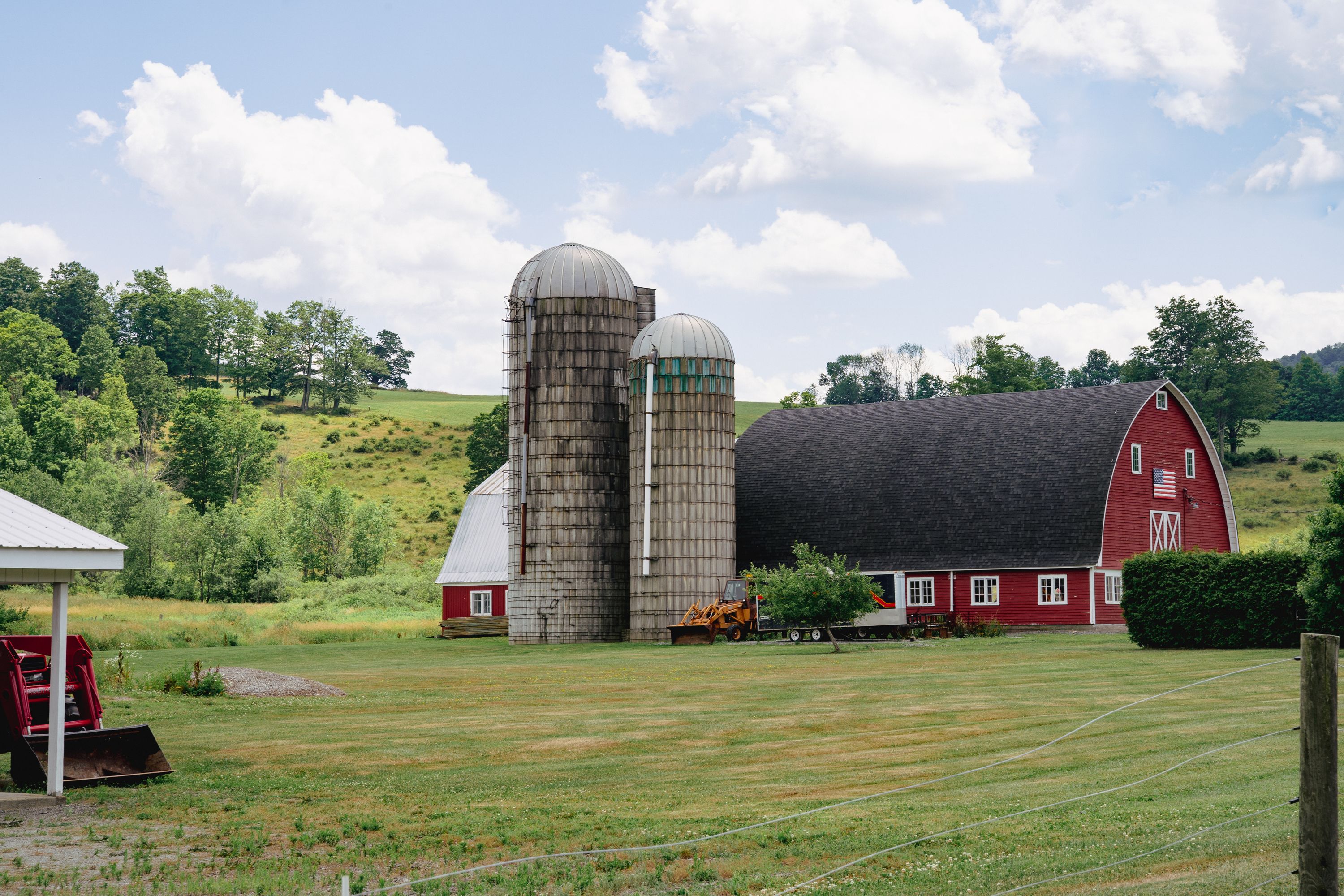 A classic red barn with silos in Upstate New York