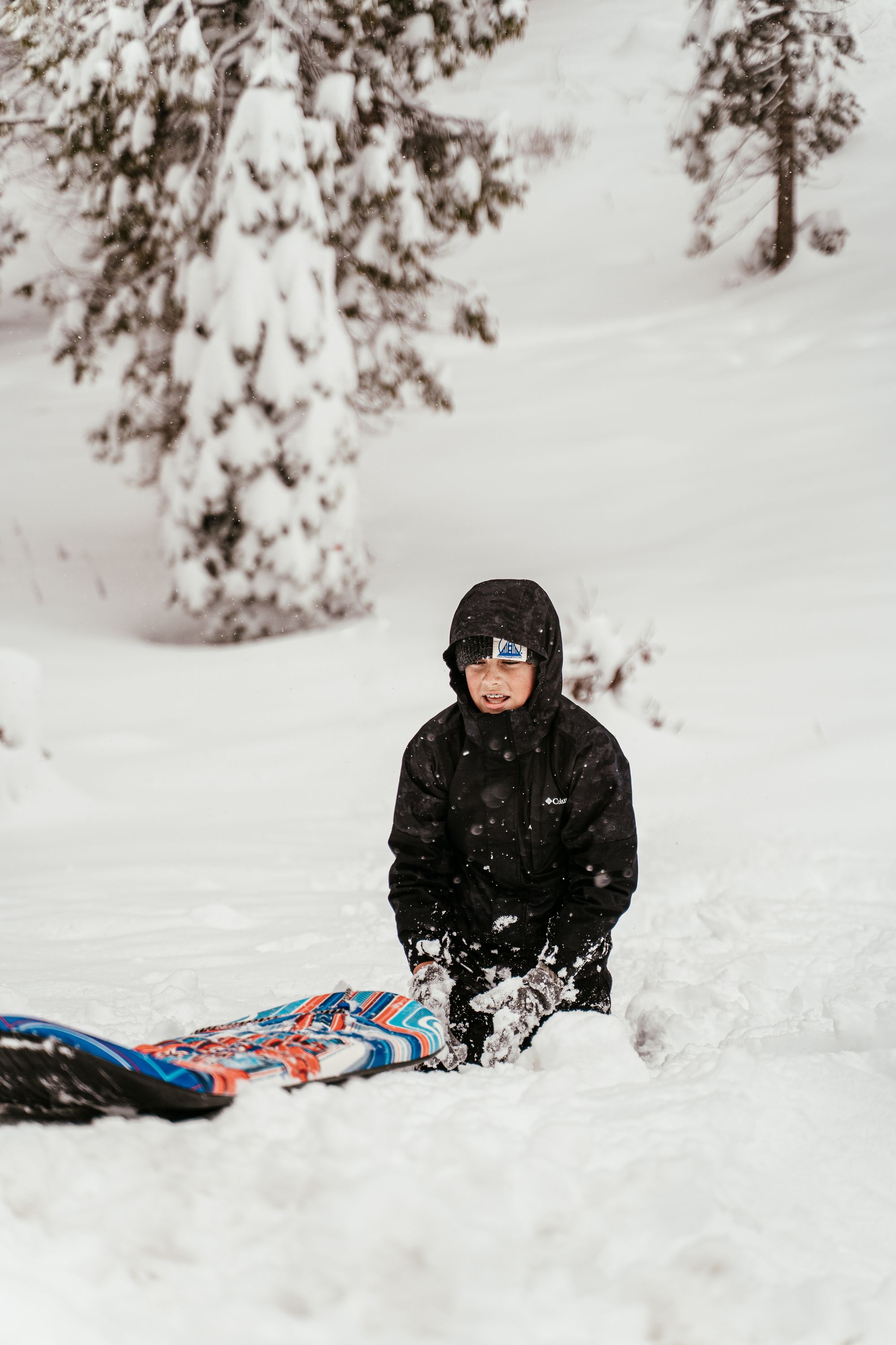 Connor sledding in deep snow