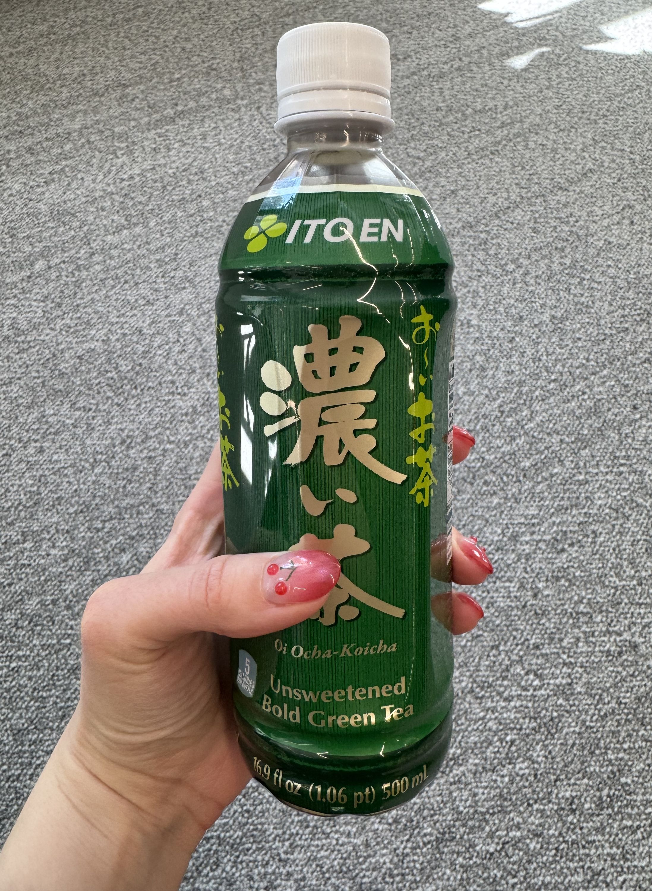 Unfortunately my nails are covering the red accent on the bottle…