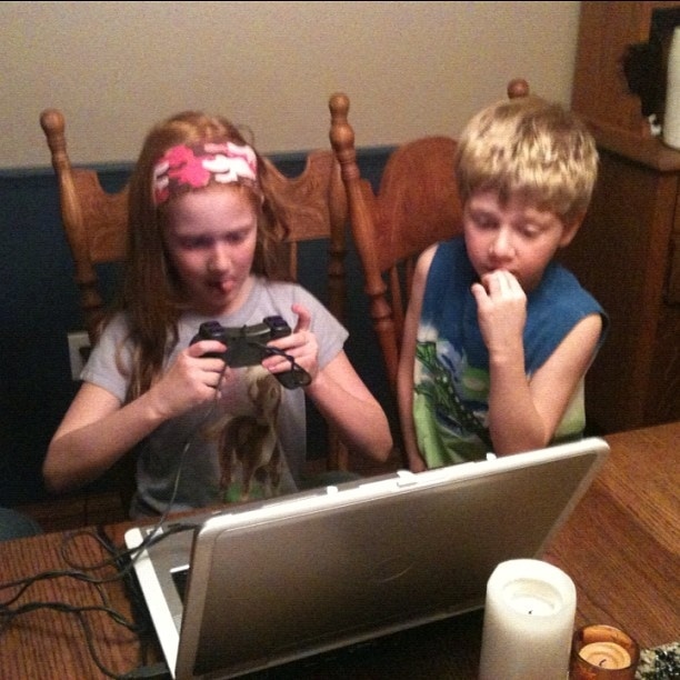 Kids gaming on a laptop