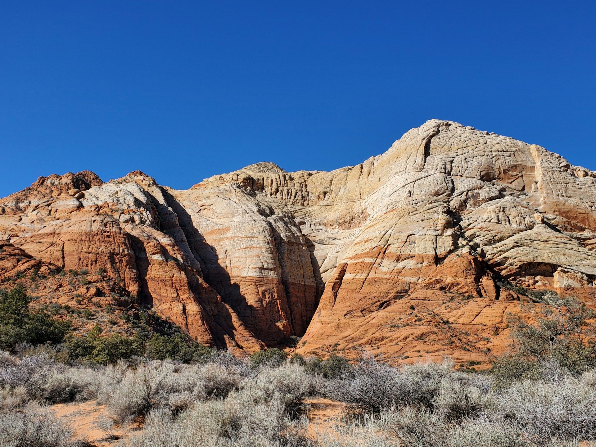 A large mountain with a very tall rock face