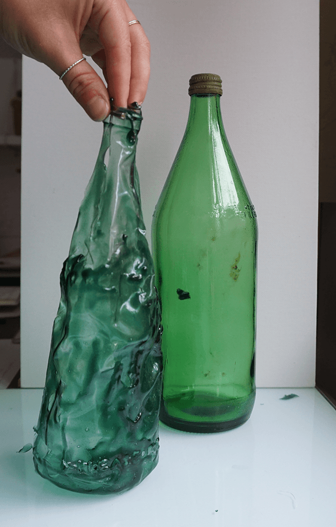 my cast gelatine-bioplastic bottle next to the original trash 7-up glass bottle