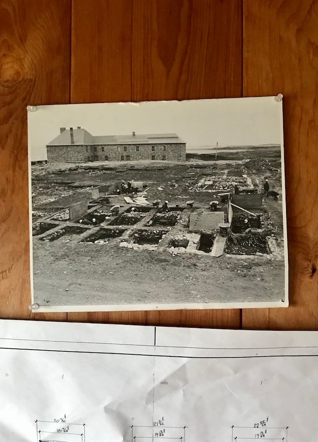 In the curator’s building, a photograph of the original archaeological dig at the site