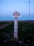 Danger sign and shortwave towers.