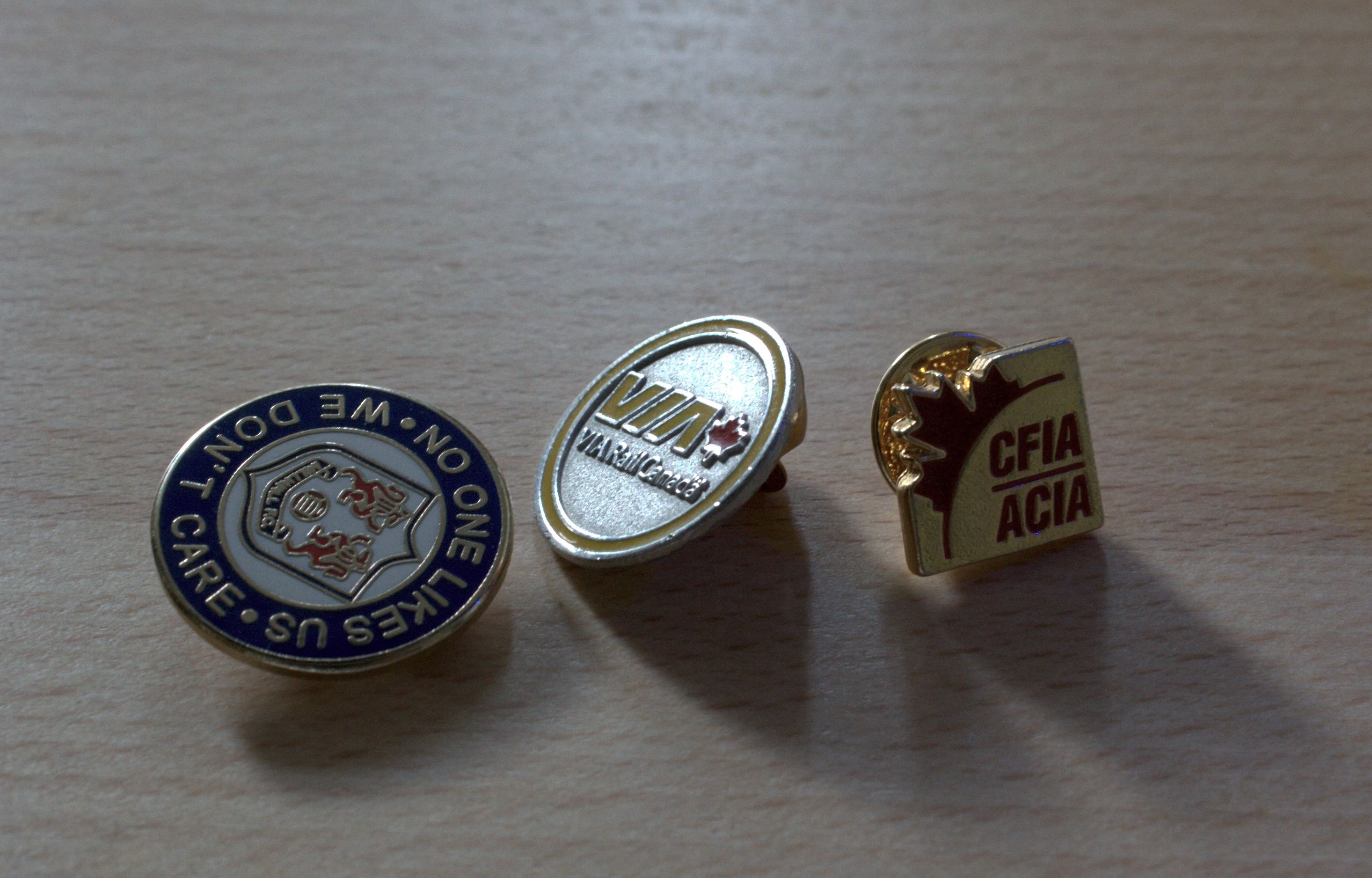 and sometimes a Canadian Food Inspection Agency pin