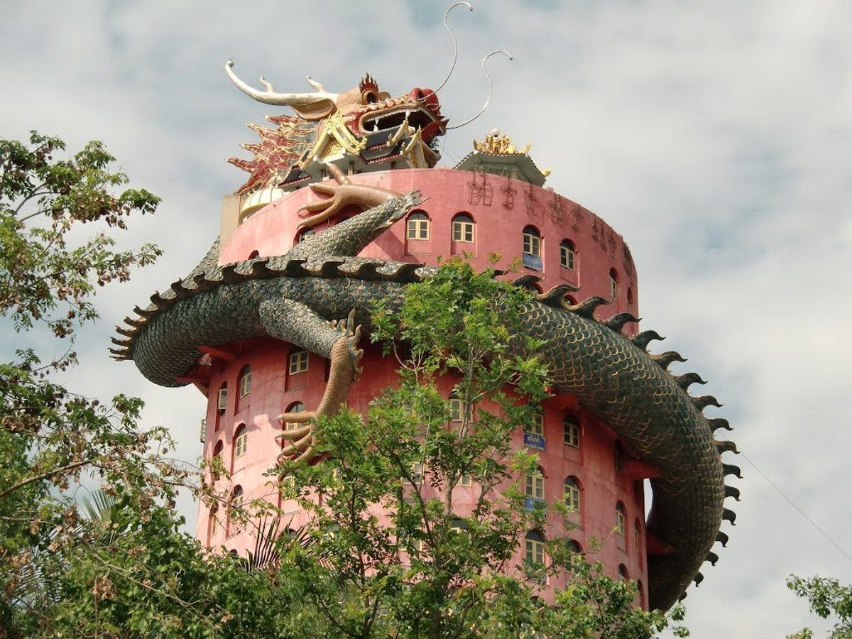 The entire body of the dragon spiraling up Thailand’s Wat Samphran Temple hides a tunnel. INAZUMA
