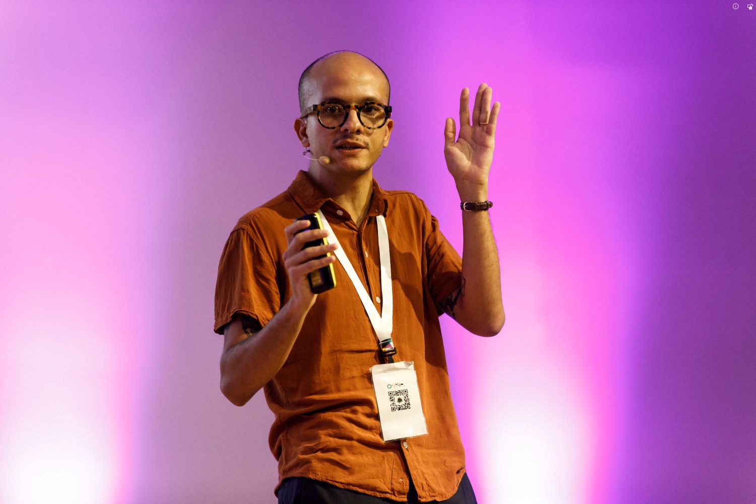 Picture of me on the stage speaking at this year’s Outlier Conference)