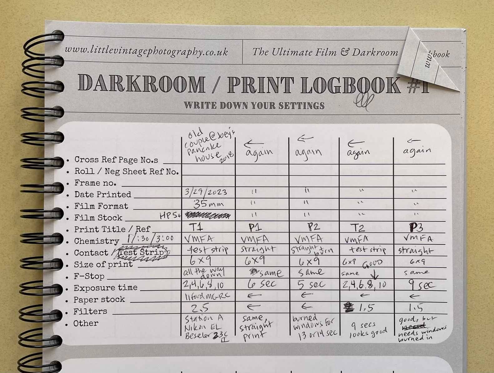 Top half of a table of photo printing details filled out in pen