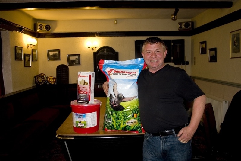 Gary Heslington of Malcolm Heslington & Jones with some of their Vanrobaeys sponsorship for the Coutances race