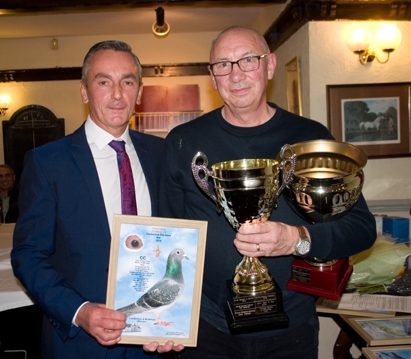 Barry Winter presenting Tom Cuthbertson with their trophies - Cuthbertson & McWilliam of Willington winners of the Coutances Old Hens race