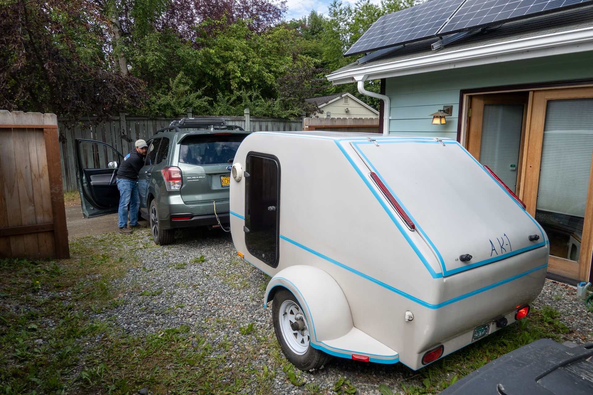 Graham packing their cute trailer for the weekend