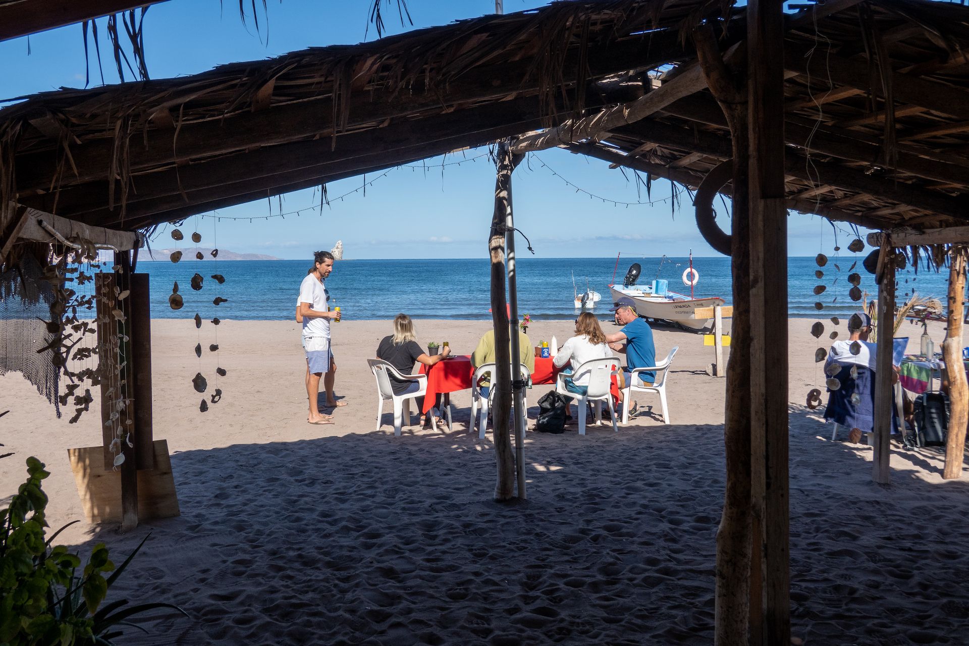 View from the palapa of the restaurant. Will and Beth chatting with the folks that came with their sail boat