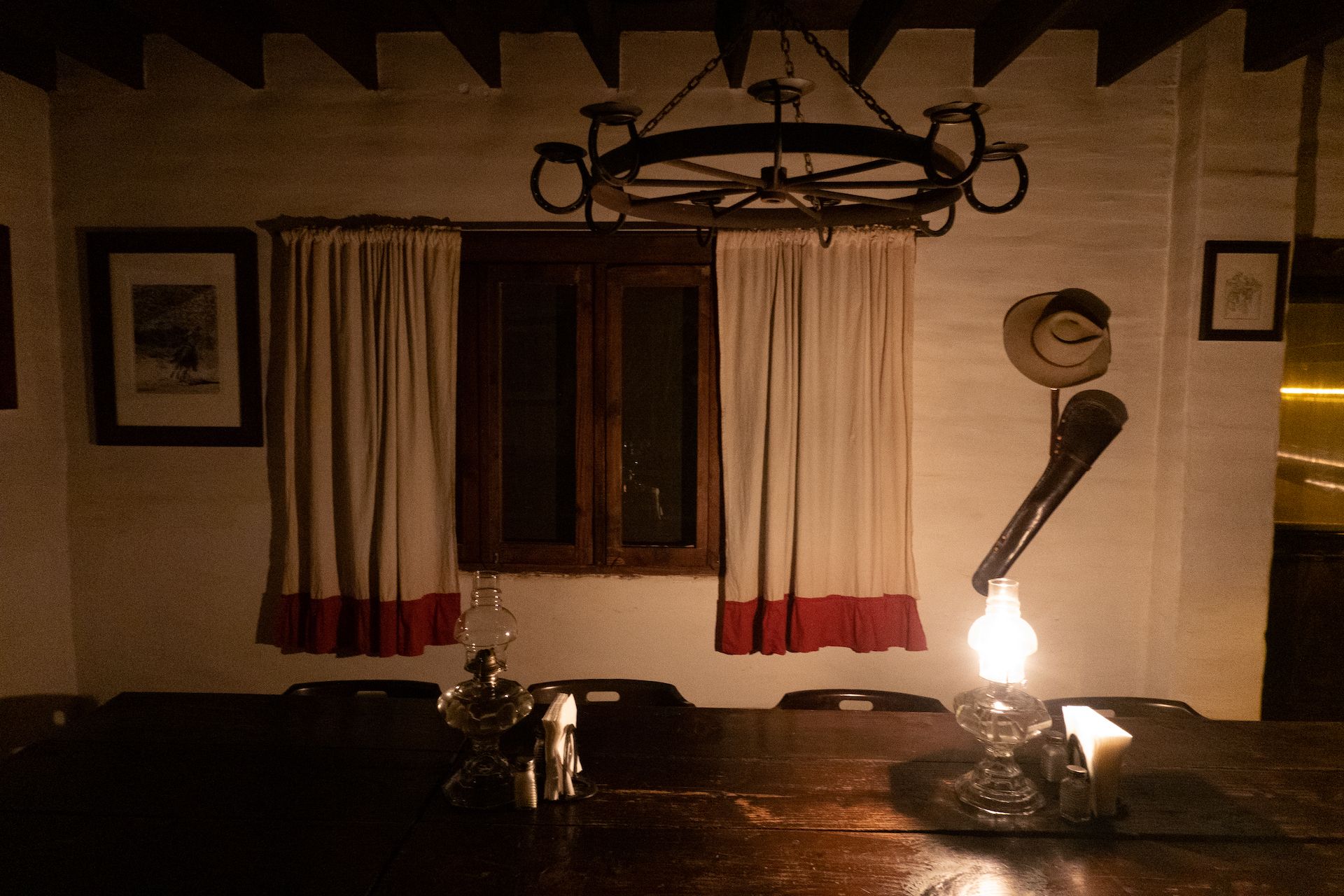 Candles are added to the chandelier for dinner