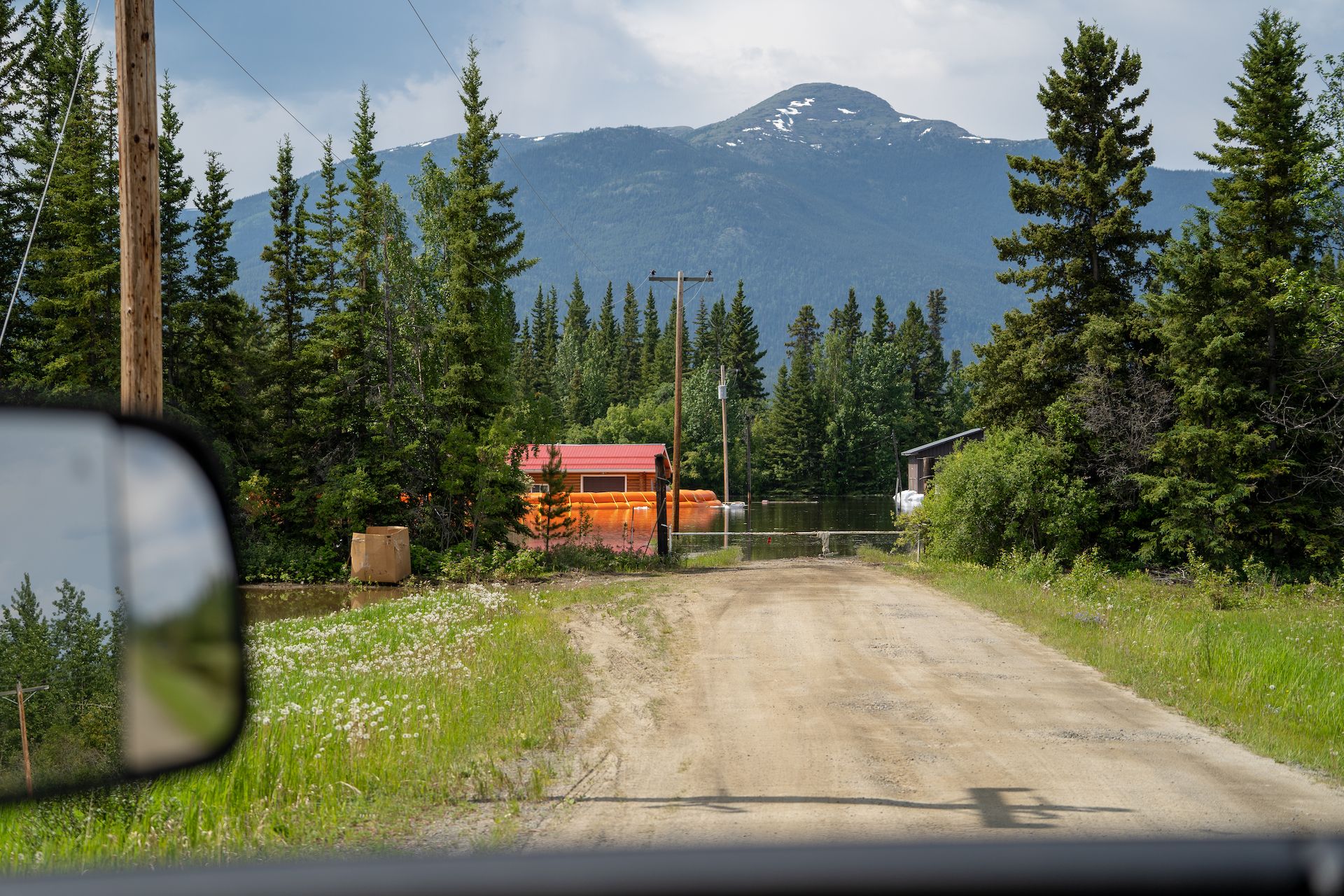 People protecting their houses with sand bags near Teslin, YT