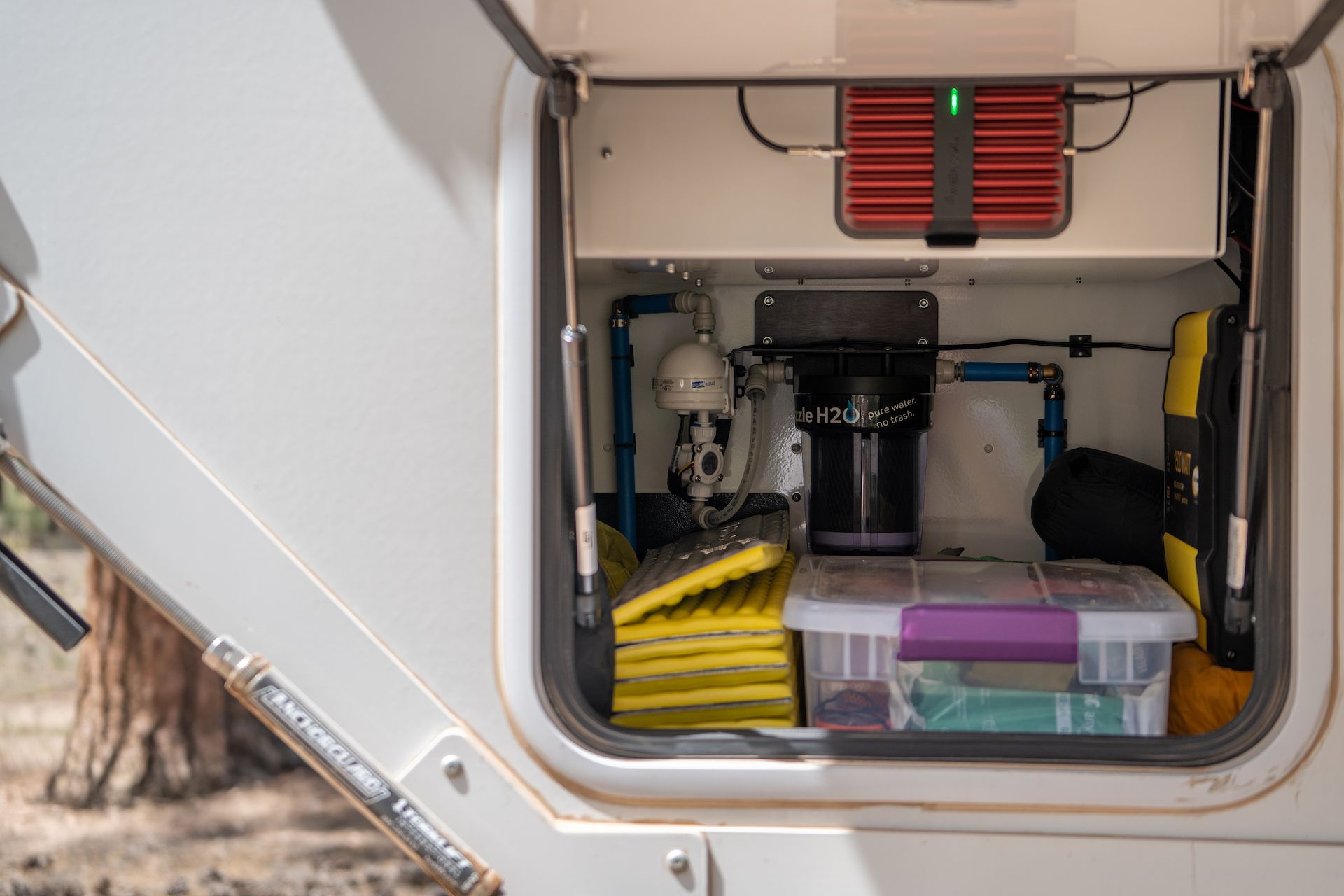 The water purification system from Guzzle H2O installed in the back of our exterior rear storage by BVO