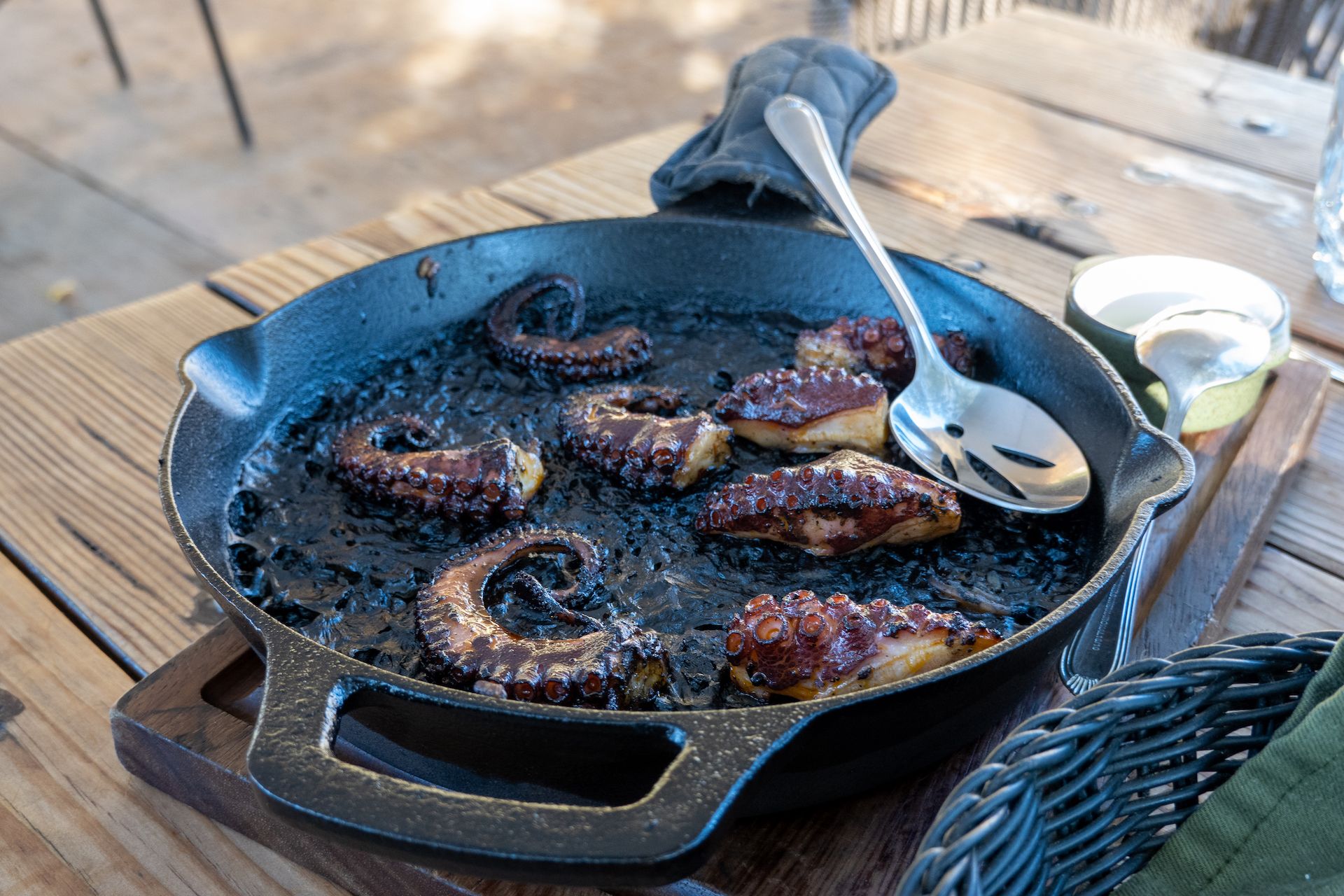 Grilled octopus atop black rice