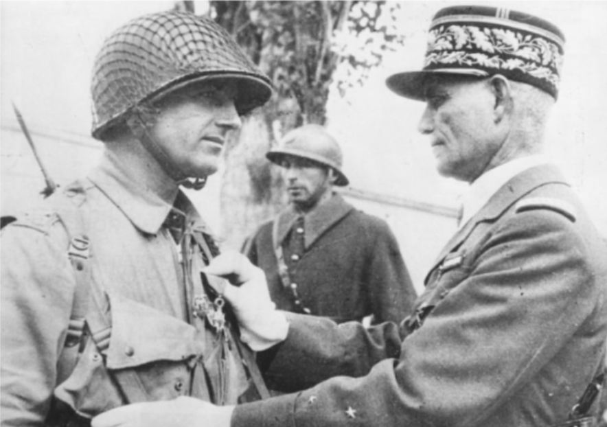 General Welvert pins the Legion d’Honneur on Colonel Edson D. Raff in North Africa, 1942. (Wikipedia)