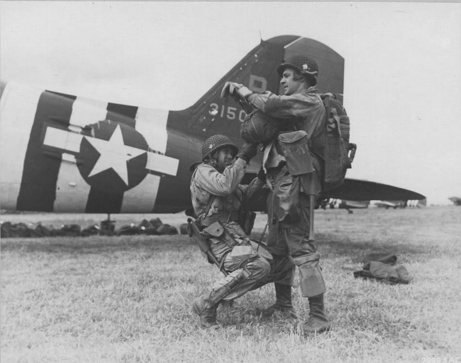 Paratroopers inspect equipment prior to takeoff. Image courtesy of the National Museum of the U.S. Army. 