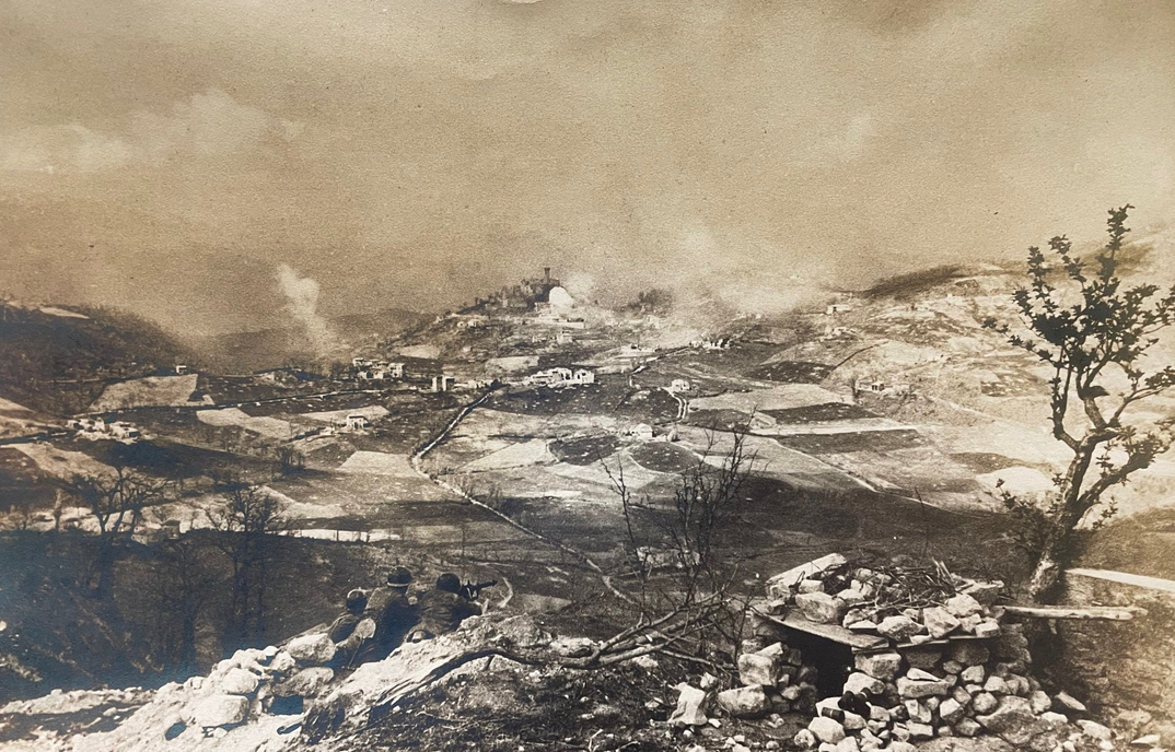 Allied soldiers overlook an Italian village under fire. Photo courtesy of USAHEC.