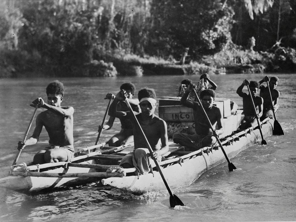 Native New Guineans transport Allied supplies by water. Image courtesy of the Library of Congress.