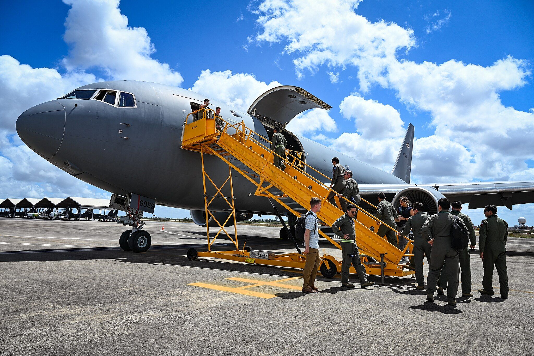 Military personnel from Argentina, Brazil, Chile and Colombia board a U.S. Air Force KC-46A Pegasus from the 305th Air Mobility Wing during CRUZEX 2024 for a static tour at Natal Air Force Base, Brazil, November 14, 2024. U.S. Air Force, CC BY-SA 2.0, via Wikimedia Commons.