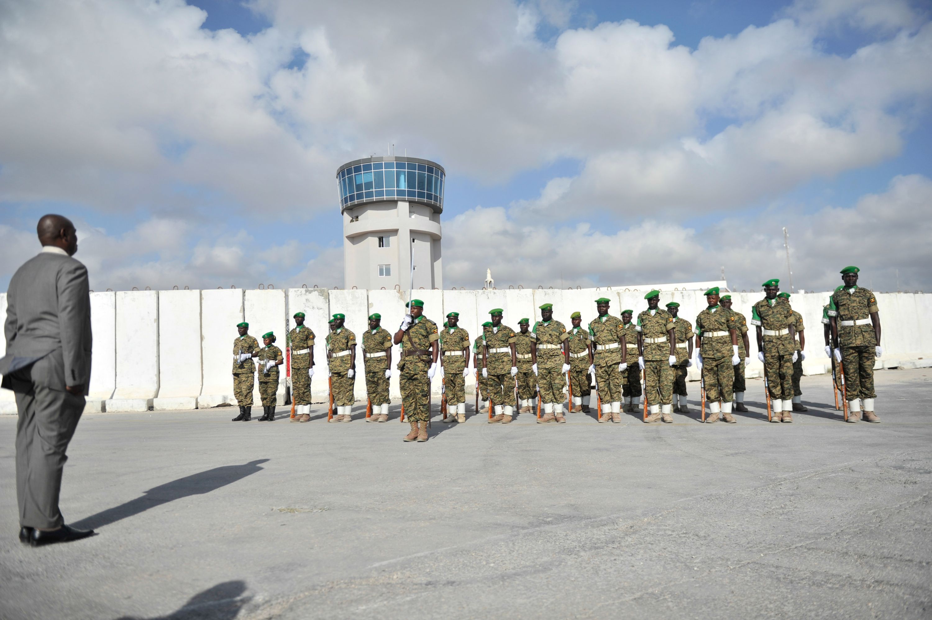 Afrian Union soldiers stand to attention during a ceremony to mark the departure of AMISOM’s Force Commander, Lt. General Jonathan Rono from Mogadishu, Somalia, on December 15, 2015. AMISOM Photo / Ilyas Ahmed. Wikimedia Commons.