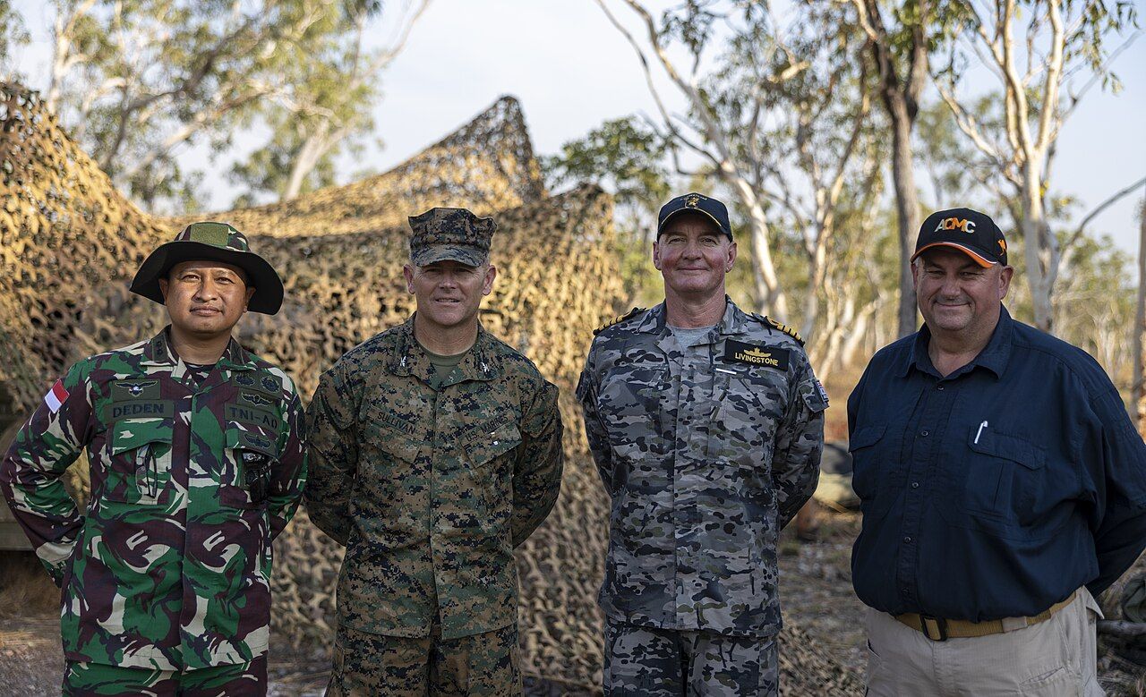 From left, Indonesian Army Lieutenant Colonel Deden Kurniawan, commander of the exercise delegation; U.S. Marine Corps Col. Brendan Sullivan, commanding officer of Marine Rotational Force – Darwin 23; Royal Australian Navy Captain Mitchell Livingstone, commander of Headquarters Northern Command; and Wayne Snell, director of concepts and capabilities with the Australian Civil-Military Centre, pose for a photo during the closing ceremony of Exercise Crocodile Response 23 at Mount Bundey Training Area, Northern Territory, Australia, May 24, 2023. Crocodile Response is a trilateral engagement between the Australian Defence Force, Indonesian National Armed Forces, and MRF-D that extends shared interoperability throughout the Indo-Pacific, increasing efficiencies in responding to crisis and contingency. (U.S. Marine Corps photo by Cpl. Adeola Adetimehin)