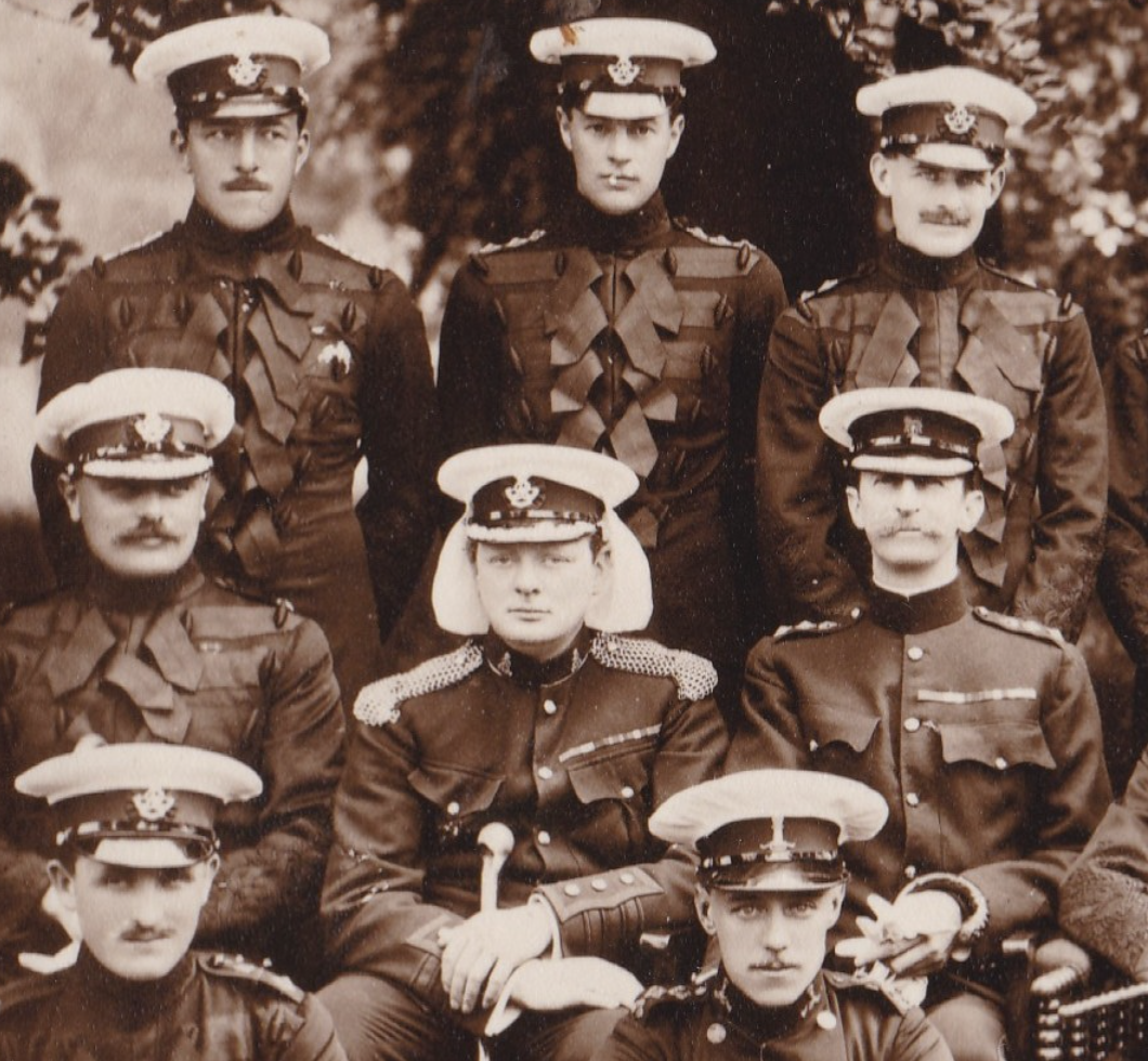 Valentine Fleming and Winston Churchill pose as members of the Queen’s Own Oxfordshire Hussars, early 1900s. Fleming can be seen in the back row, far right. Churchill, unmistakably, sits in the center.