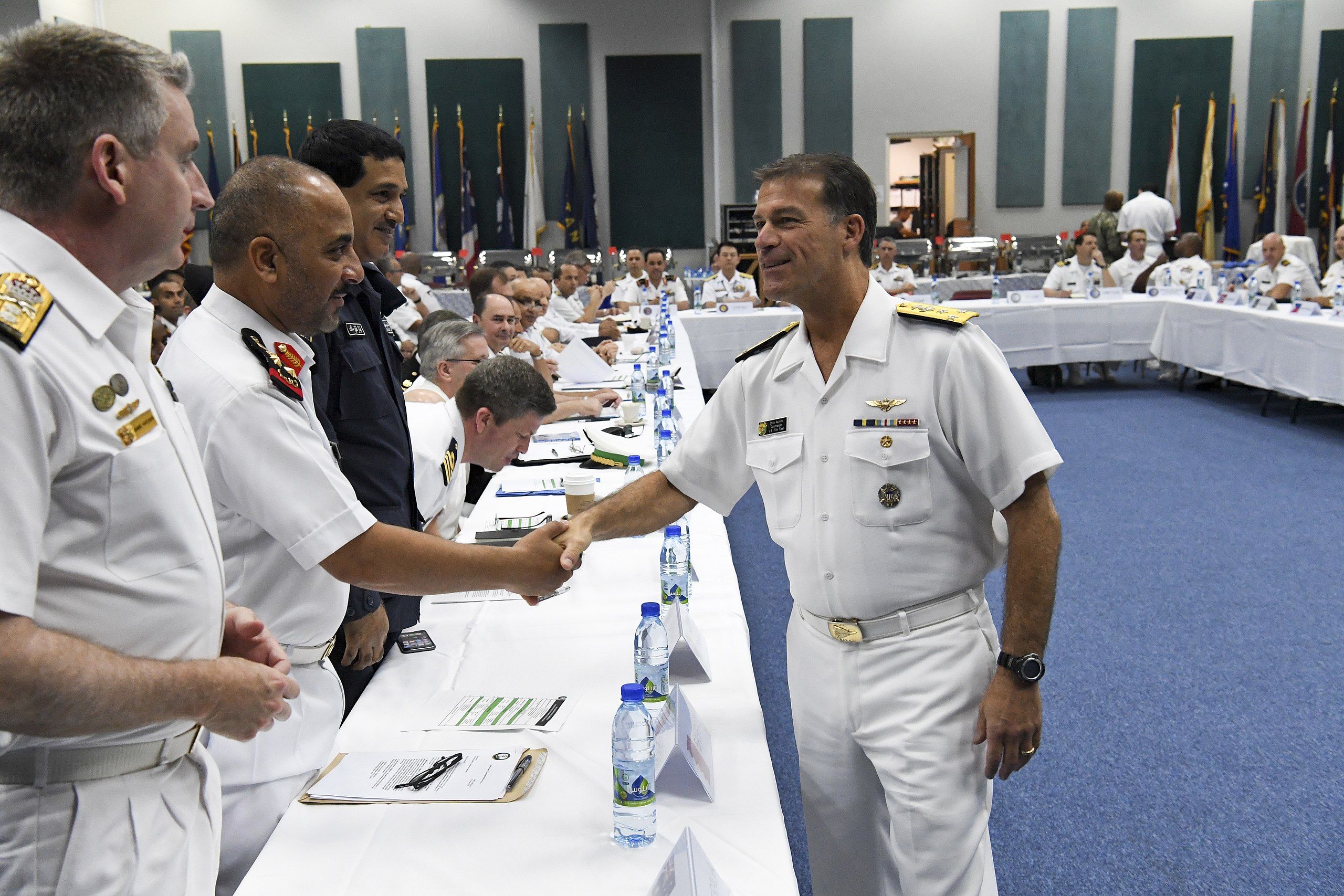 MANAMA, Bahrain (March 14, 2018) Commander, U.S. Naval Forces Central Command Vice Adm. Chris Aquilino greets attendees at the Combined Maritime Forces (CMF) Commander’s Conference onboard Naval Station Bahrain. The conference brought together senior military leaders from more than 30 nations to discuss maritime strategy, counter piracy and emerging threats in the U.S. 5th Fleet area of operations. (U.S. Navy photo by Mass Communication Specialist 2nd Class Kevin J. Steinberg/Released)