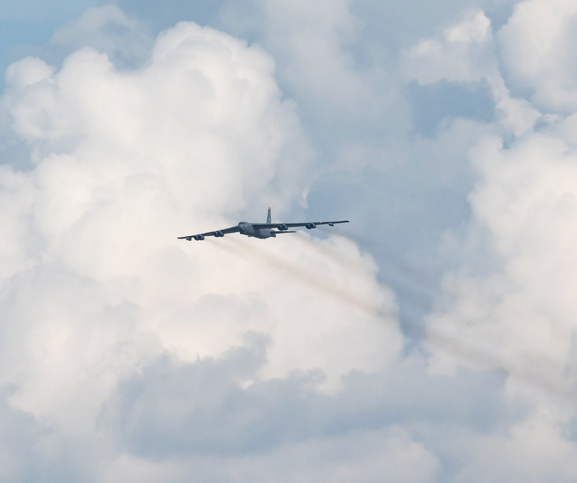 An American Boeing B-52 Stratofortress streaks across the sky.