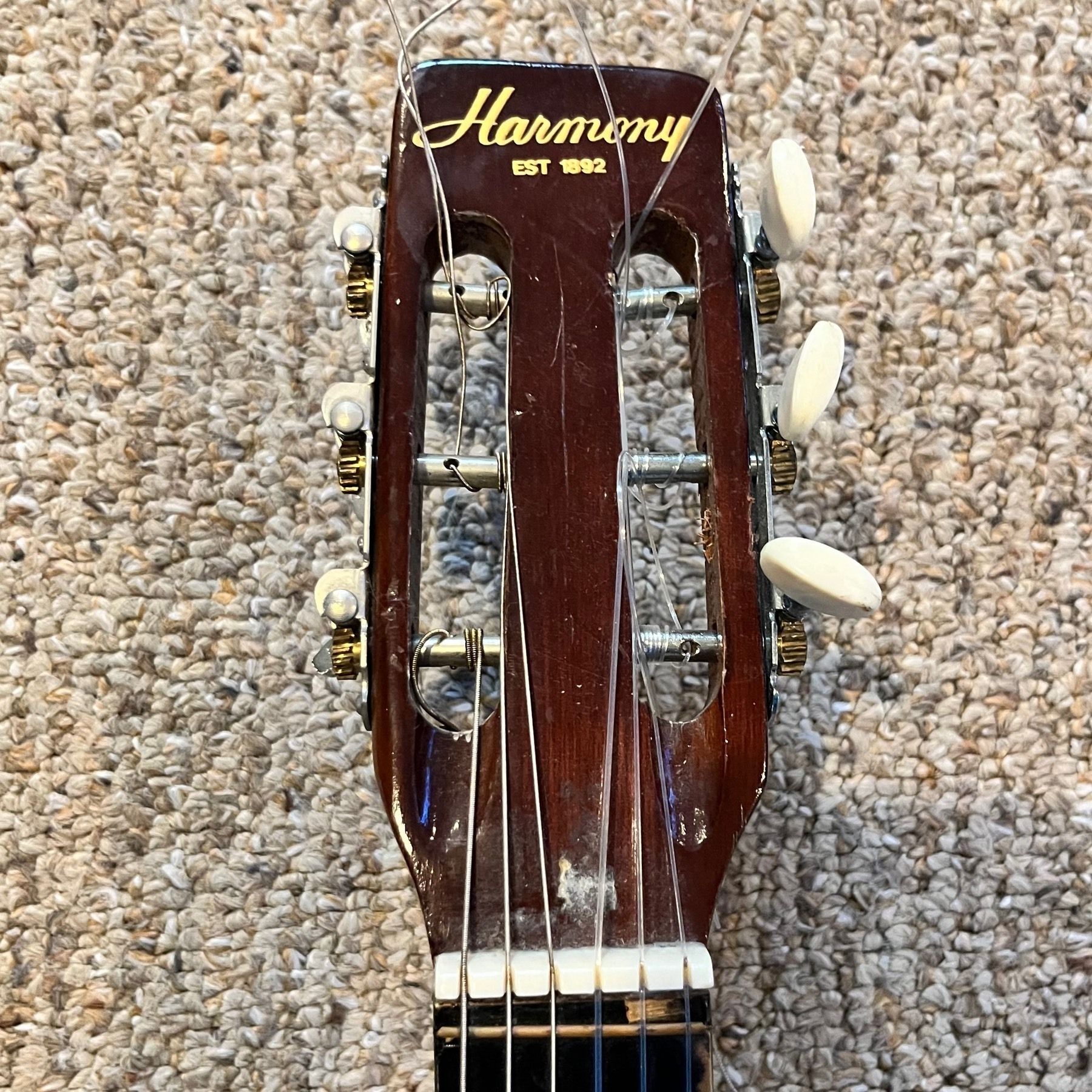 Headstock of my first guitar, a Harmony classical strung with nylon strings.
