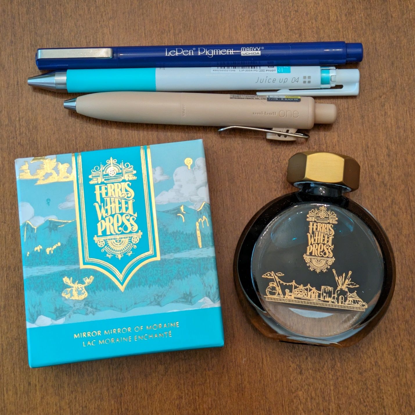 Of course I bought pens and ink. Although the full size uni-ball One doesn't do much for me, the pocket-sized P model is quite appealing. I think I'll try the Ferris Wheel ink in my Sailor Fude nib pen.