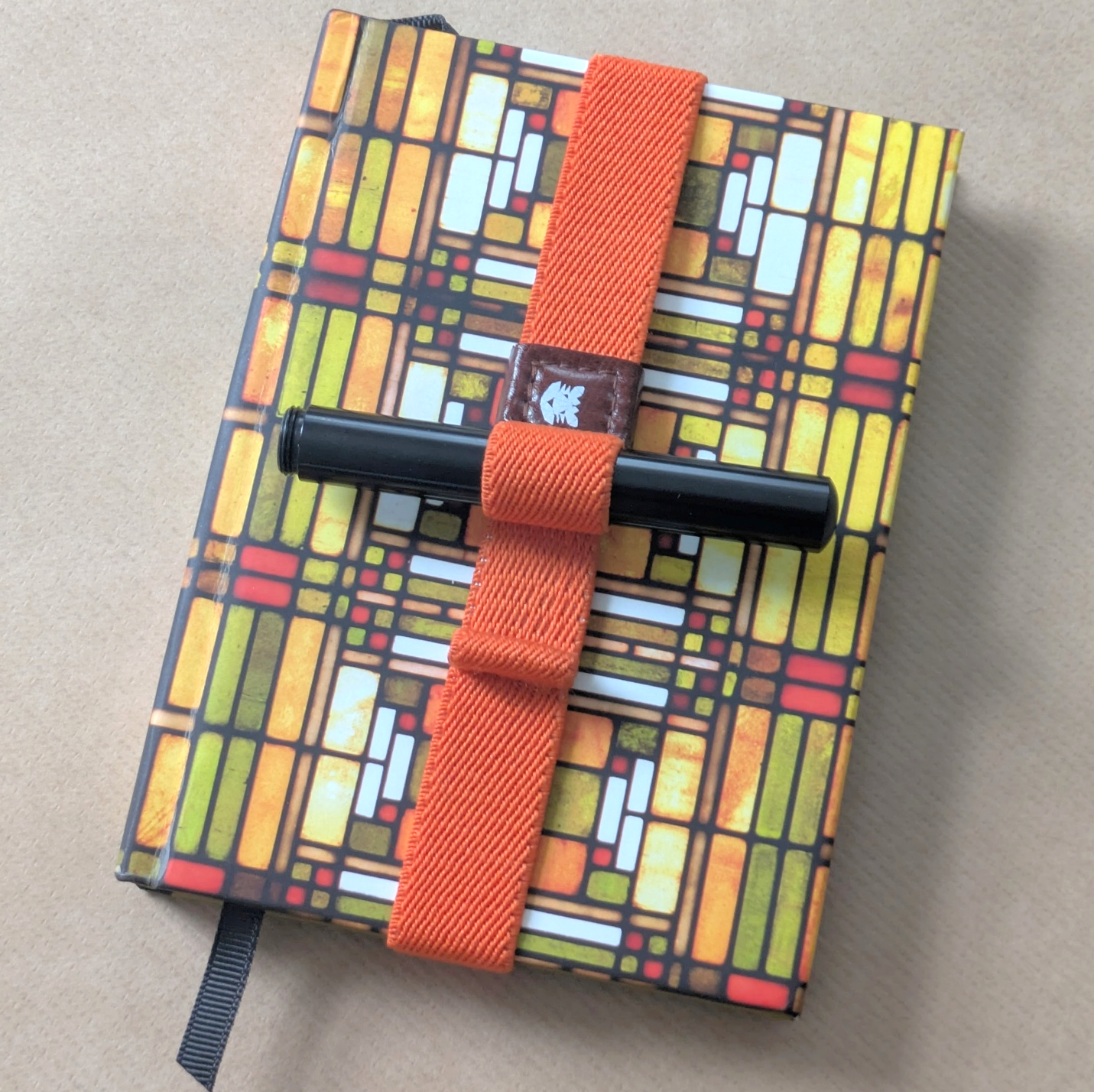 Gaming journal and Schon P6 joining forces via a Papier Tigre notebook strap. 