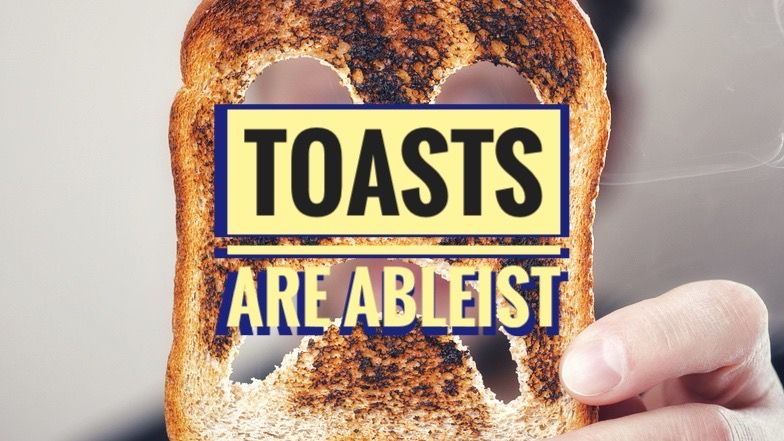 A picture of burnt toast with a sad face carved into it. The words “toasts are ableist” are visible over it.