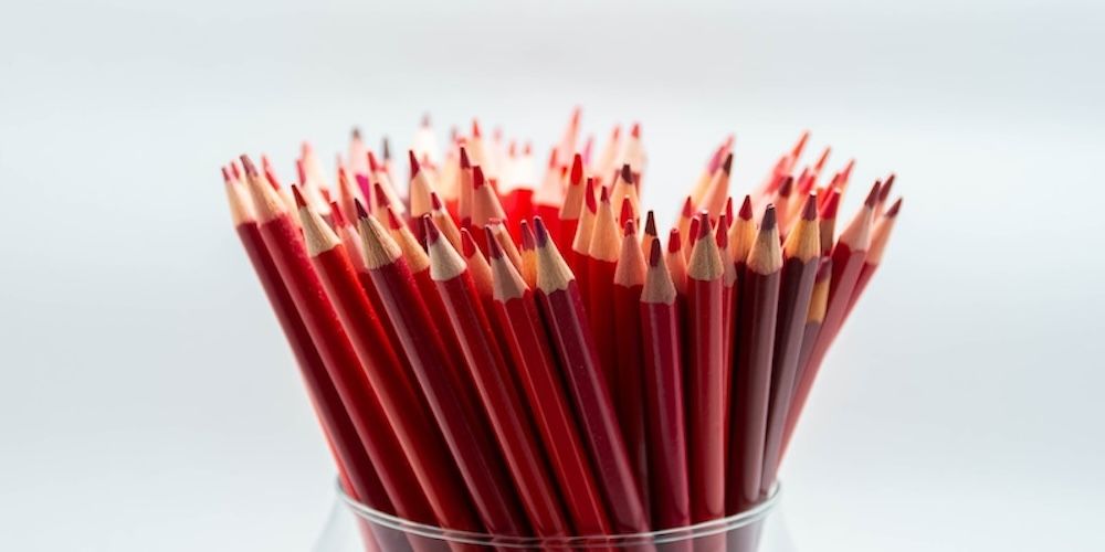 Red pencils in a glass