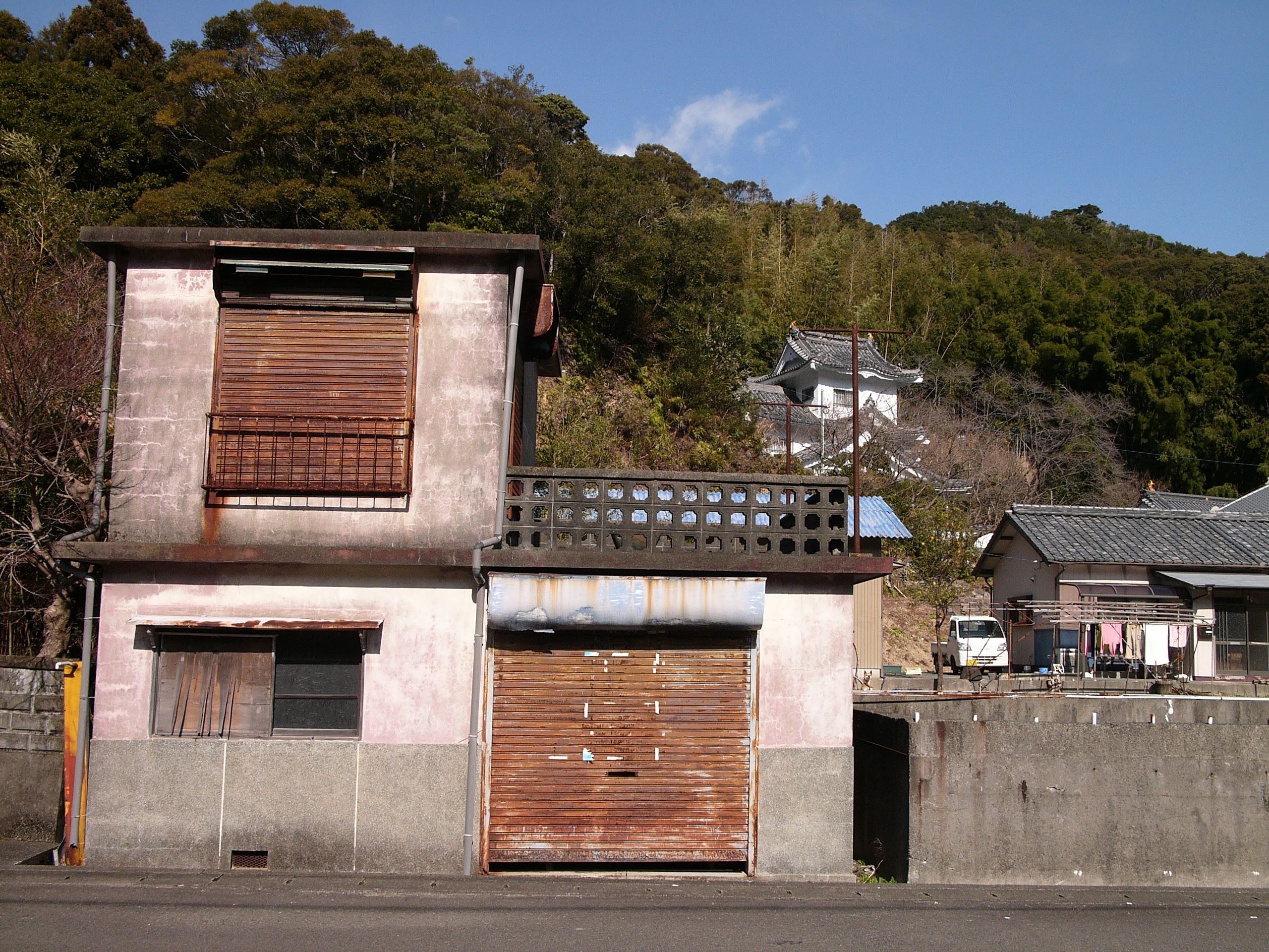 Square village houses on a sunny street.