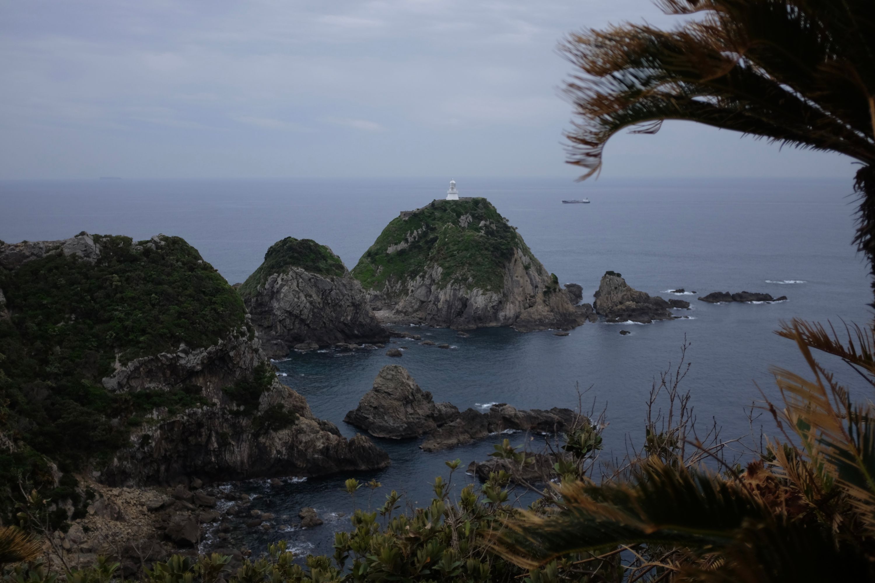 A lighthouse on top of a seemingly inaccessible rock in the sea at Cape Sata.