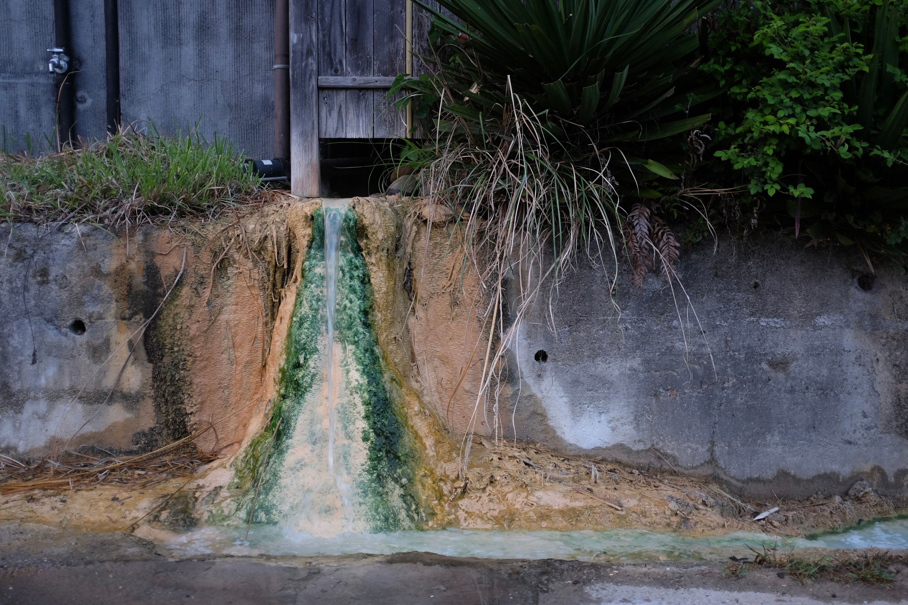 A thick buildup of minerals around the outflow of a hot spring.