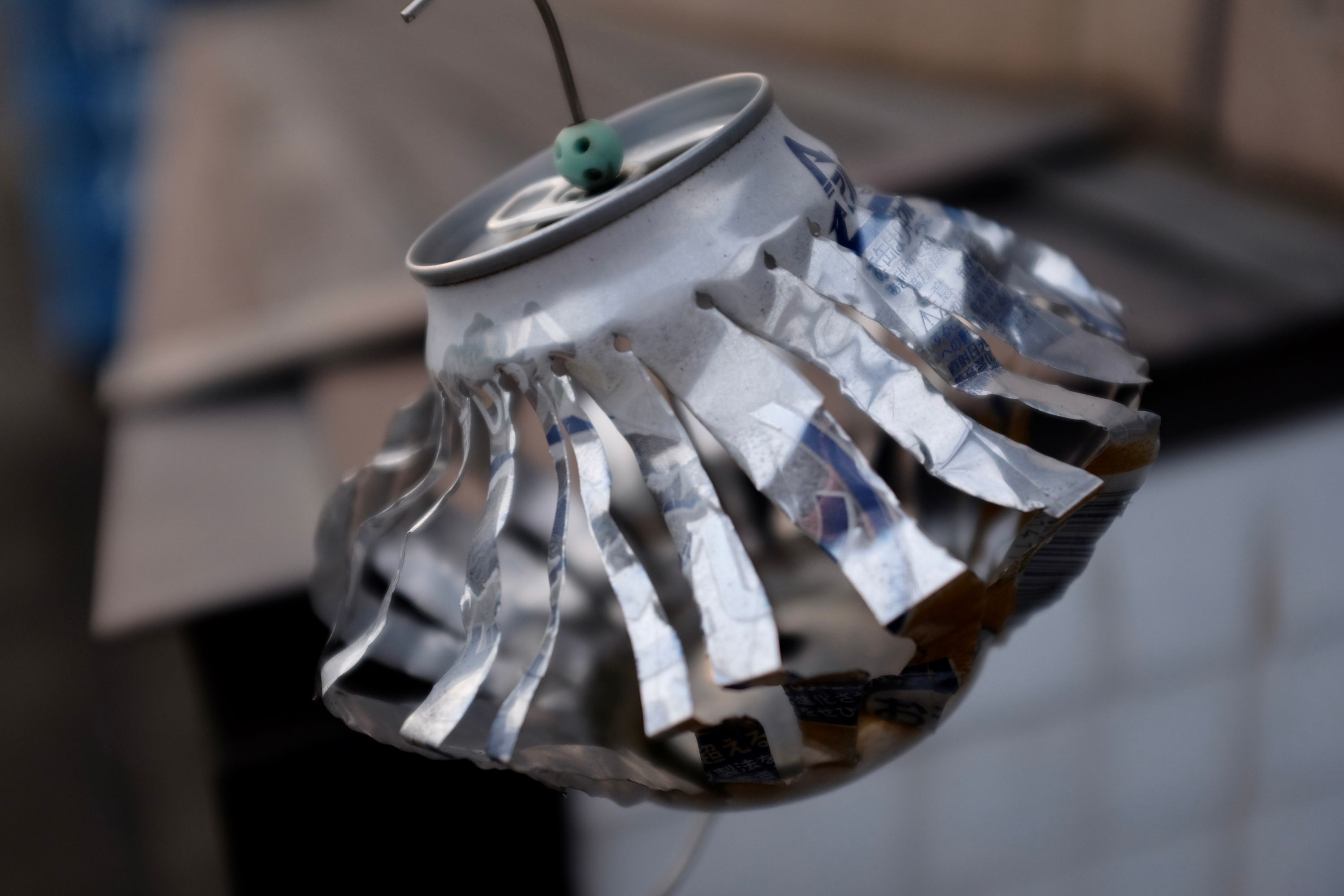 A wind chime made from an aluminium can.
