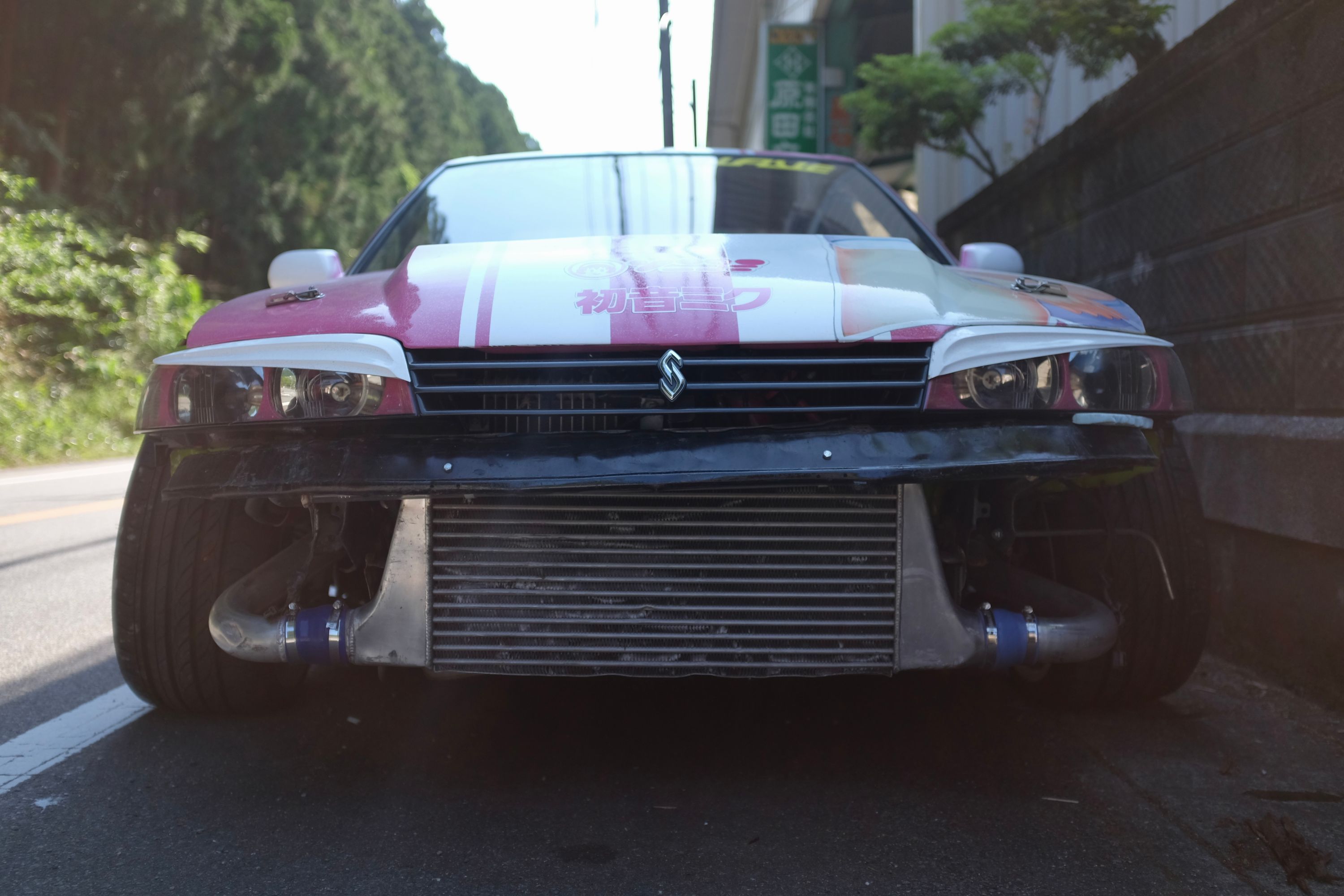 Looking into a Nissan Skyline R32’s intercooler from the front.