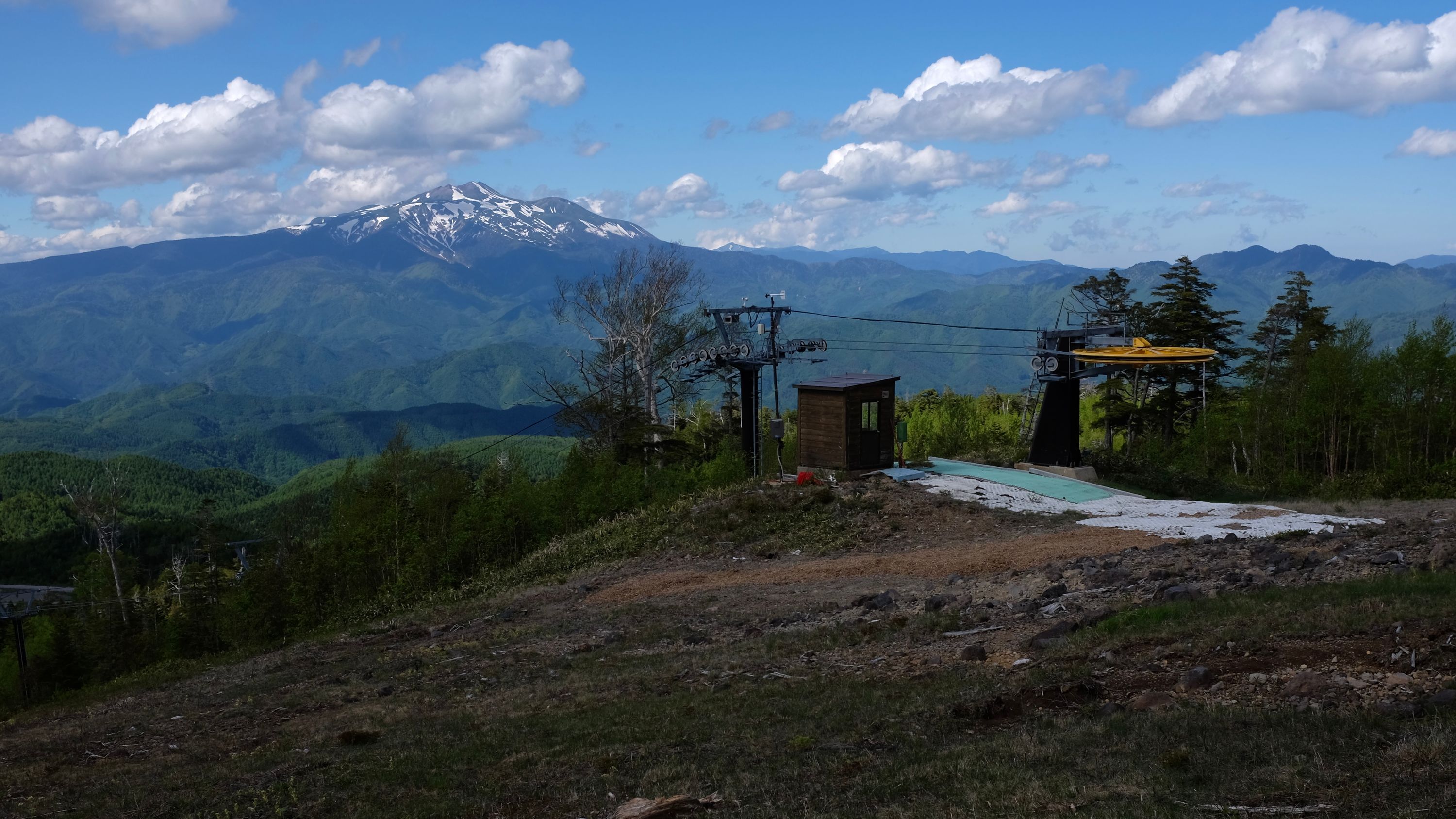 Looking at Mount Norikura from a ski slope on Mount Ontake.