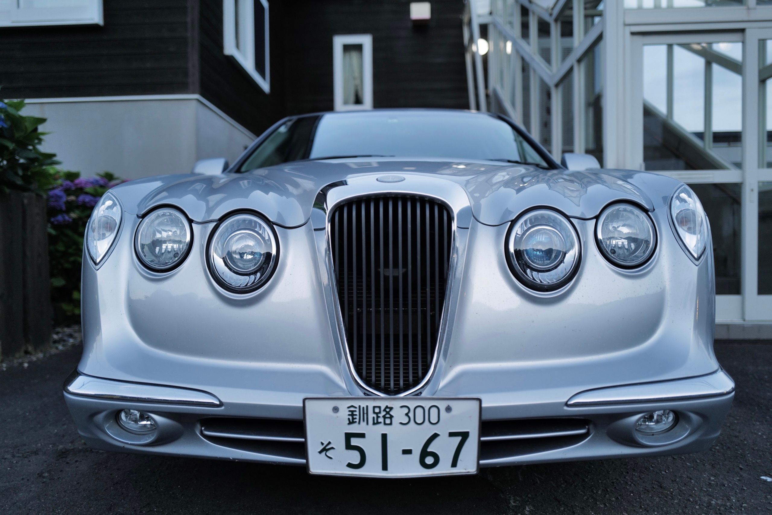 Closeup of the front of a Mitsuoka, an obscure Japanese car.