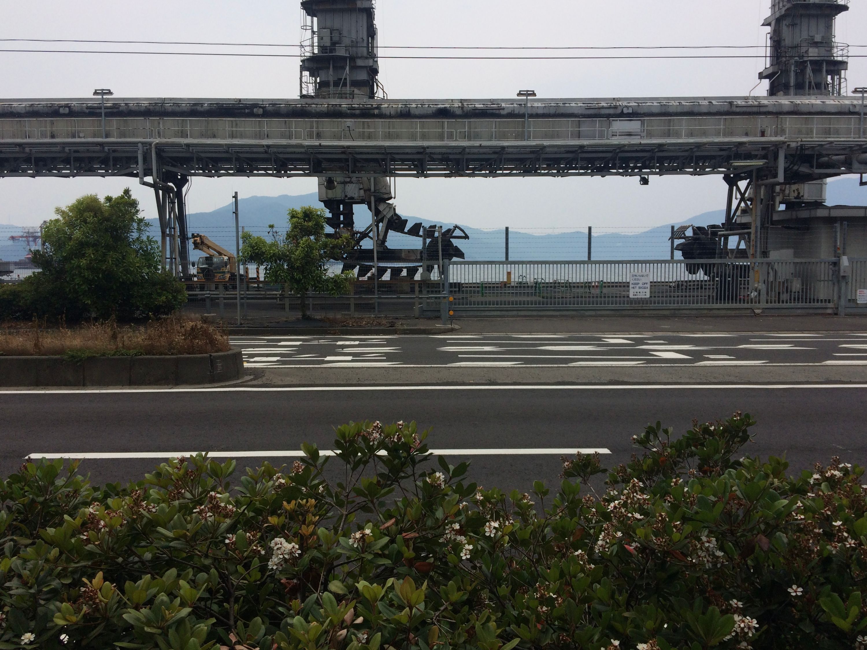 Big machines over the same road across the cement factory.