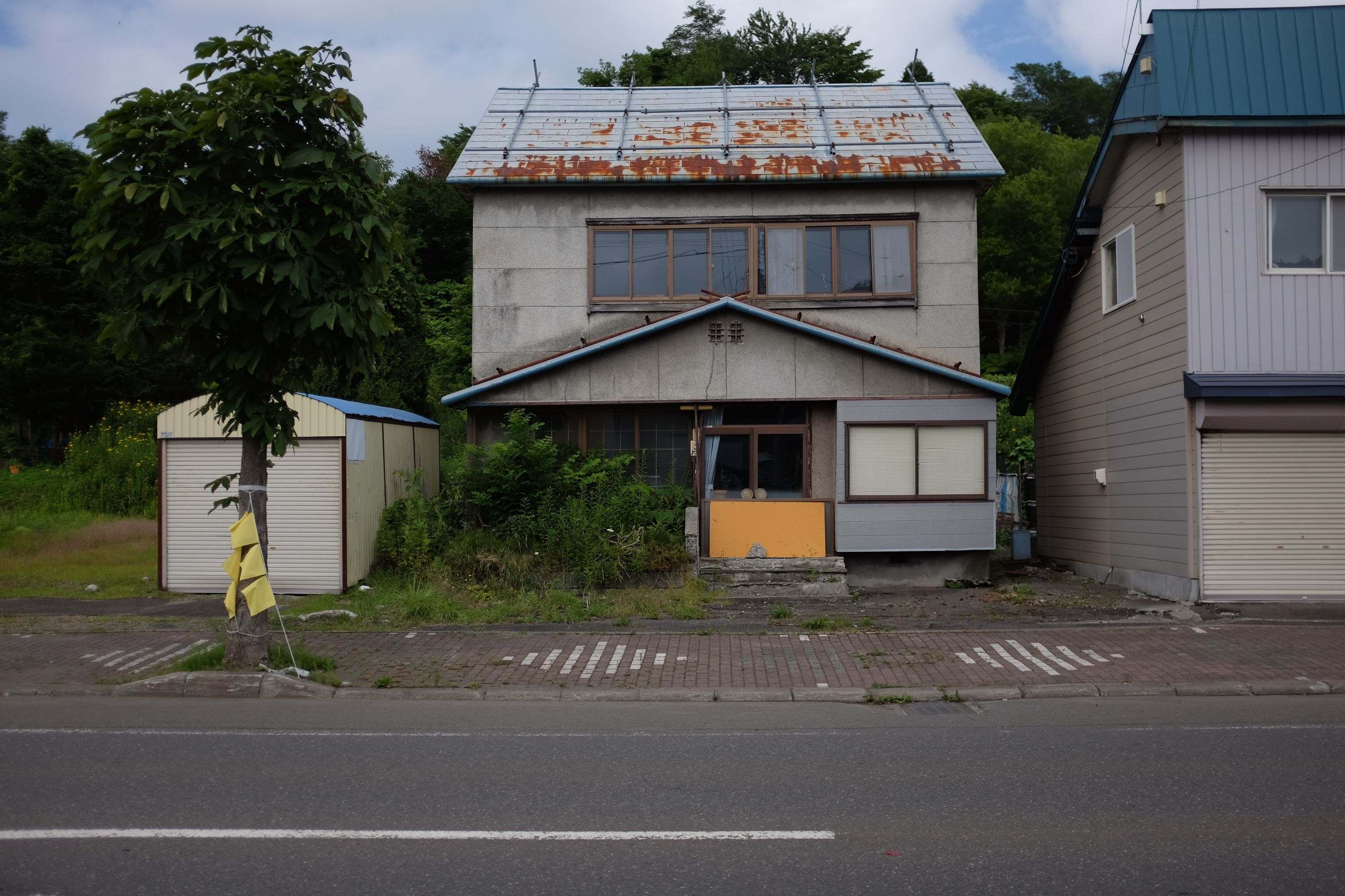 A rusting, abandoned-looking house.