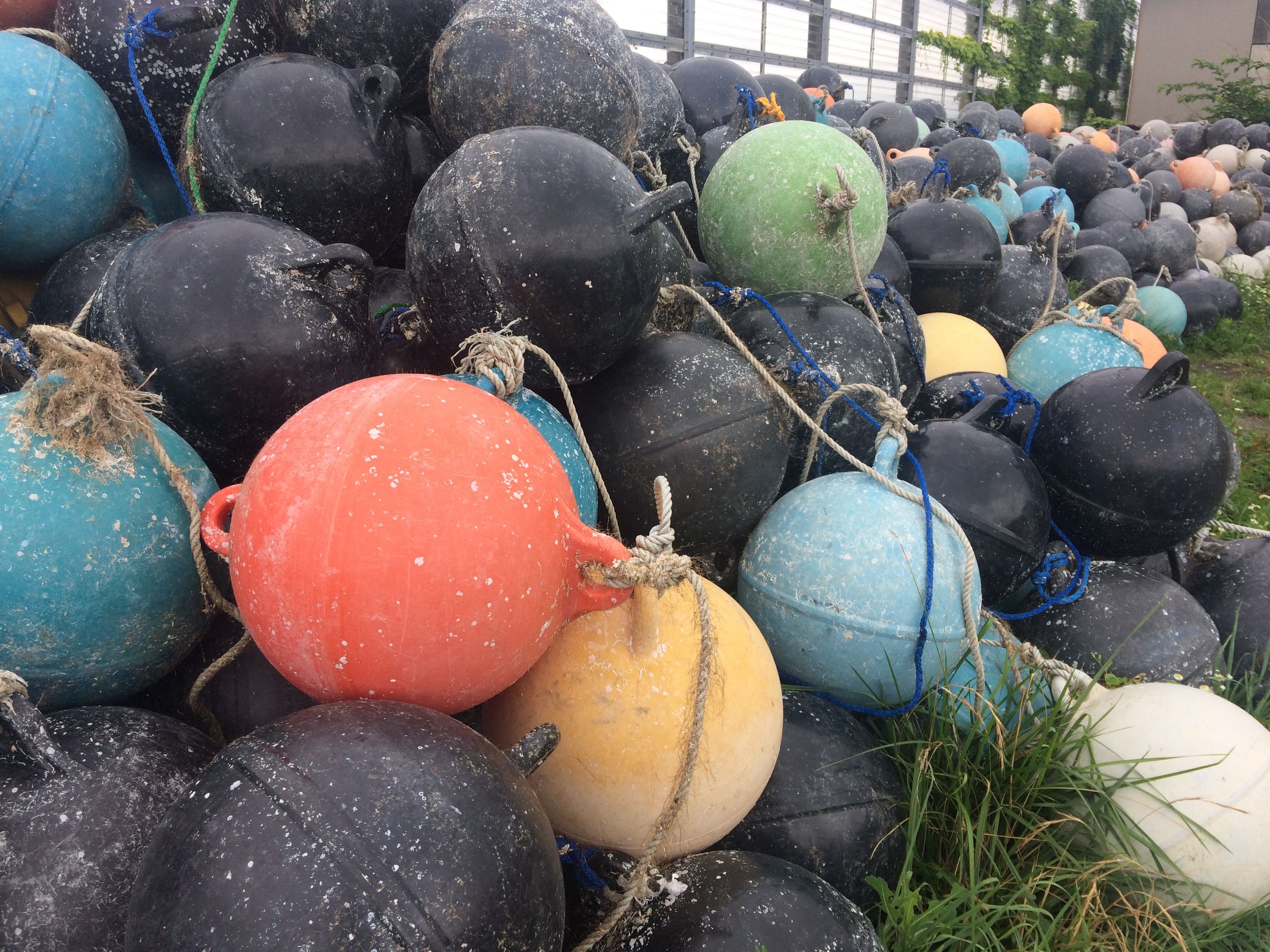 Colorful fishing floats in a heap.