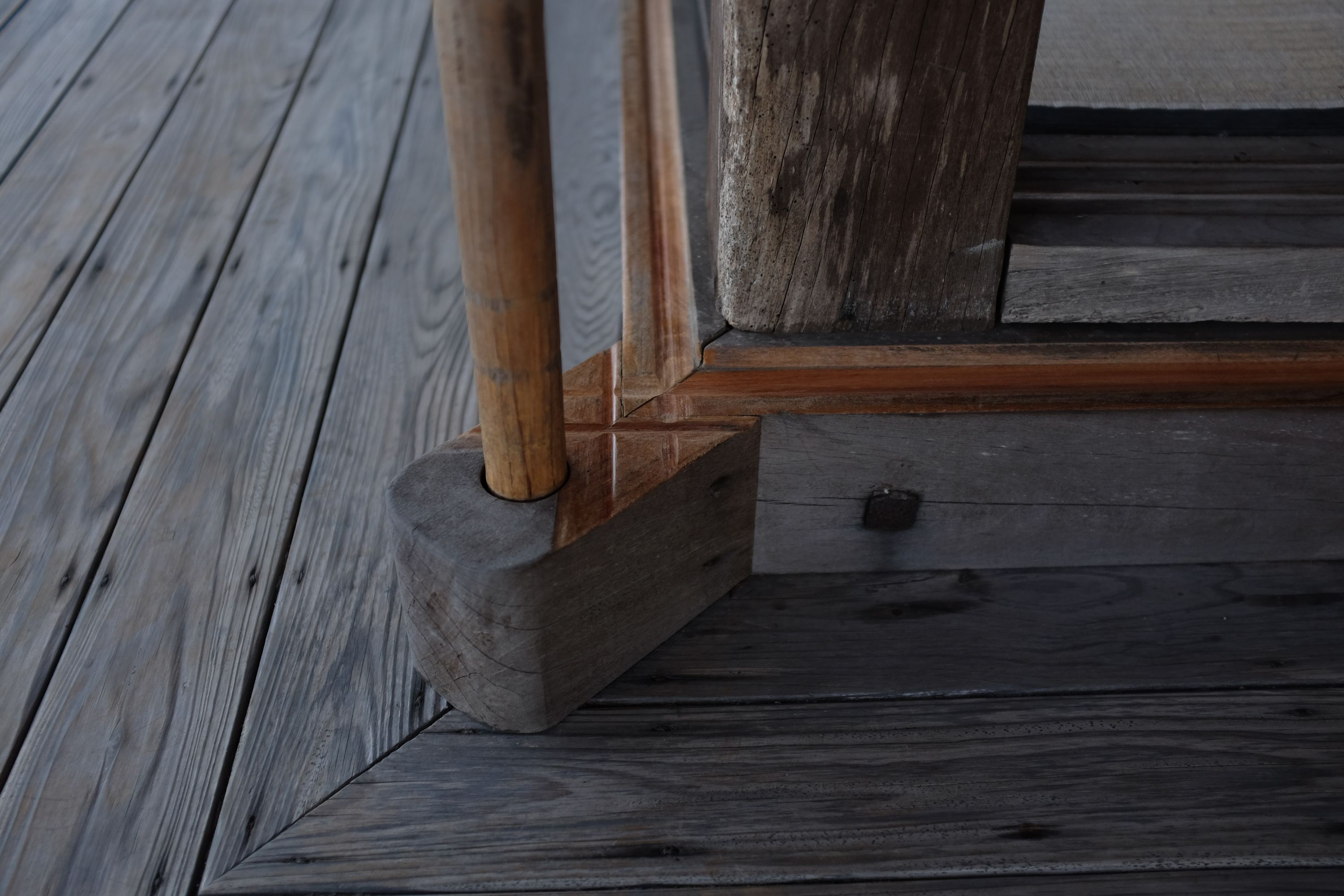 Detail of the intricate woodwork of a sliding door on the porch of a teahouse.